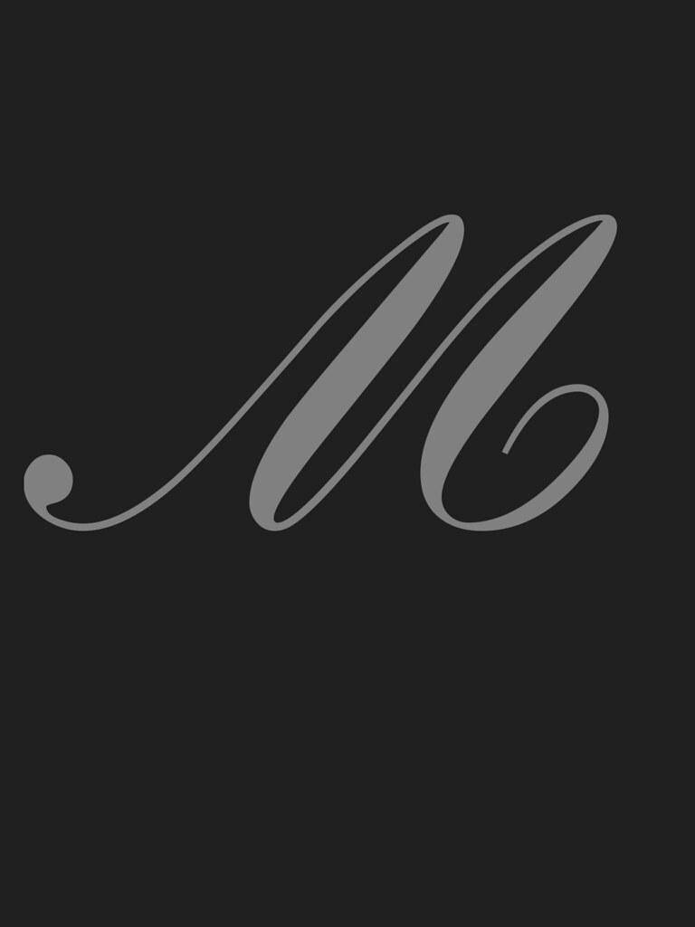 m 桌布 壁紙 — 一個極簡灰色字母組合 'M'，優雅地書寫在純深炭色背景上。