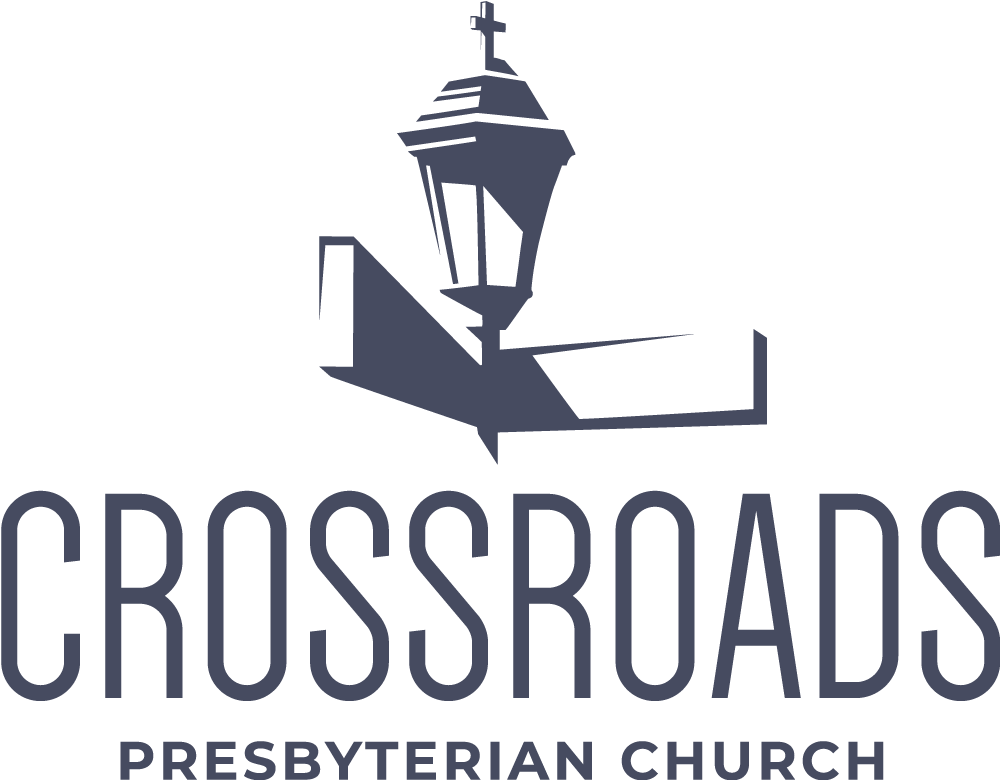 Crossroad 桌布 壁紙 — 一個極簡灰色教堂尖頂標誌，十字架位於指向右方的箭頭上，背景為黑色。