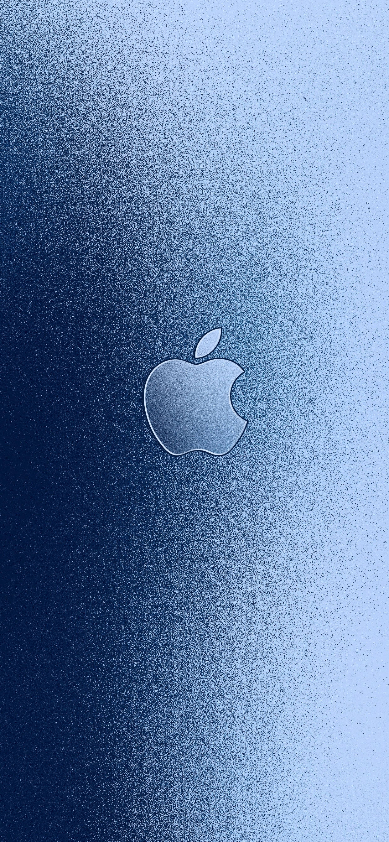 藍色 桌布 壁紙 — 一個極簡的Apple標誌，居中放置在帶有柔和照明的漸變藍色紋理背景上。
