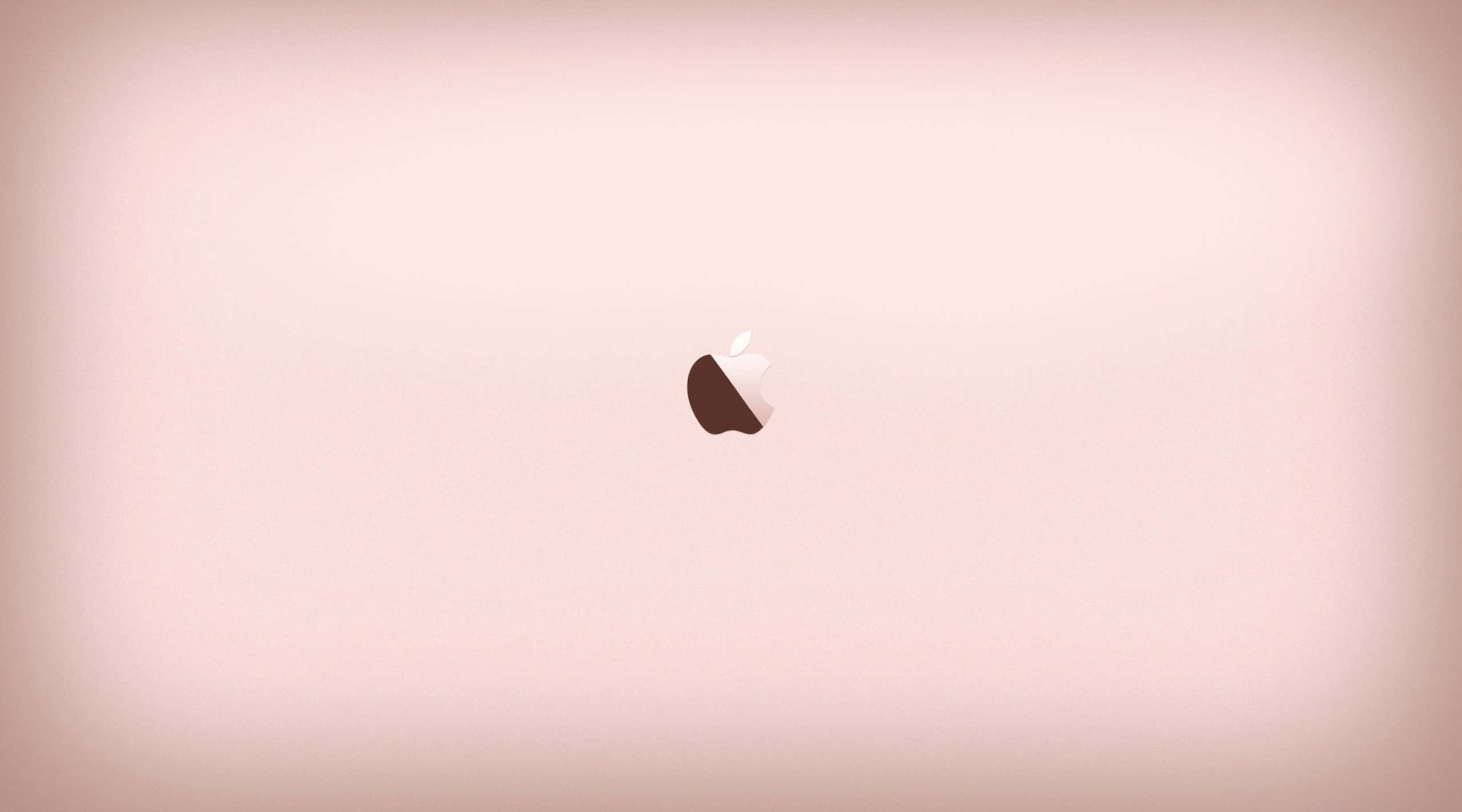 Rose Gold Desktop 桌布 壁紙 — 一個極簡的Apple標誌，居中放置在柔和粉紅色漸變背景上，帶有微妙的燈光效果。