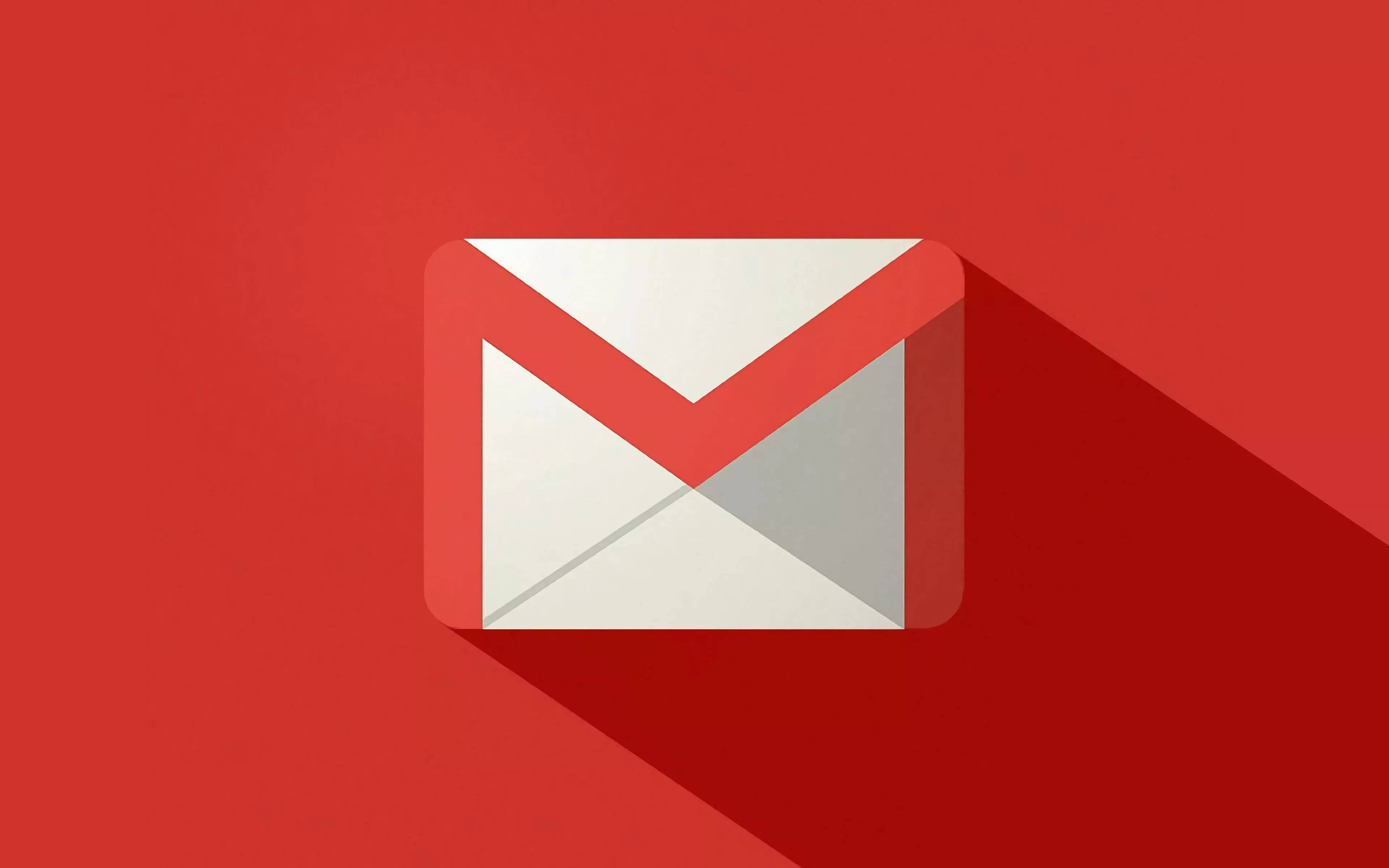 Gmail 動圖 桌布 壁紙 — 一個極簡的Gmail信封圖示在純紅色背景上投下長長的陰影。
