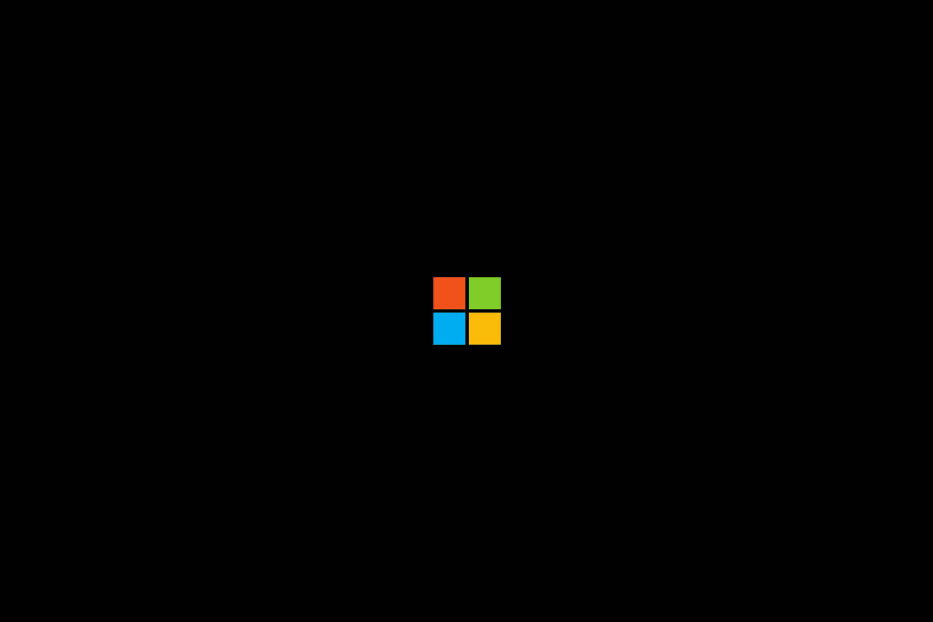 Microsoft標誌，四個彩色方塊在黑色背景上 — Microsoft 壁紙