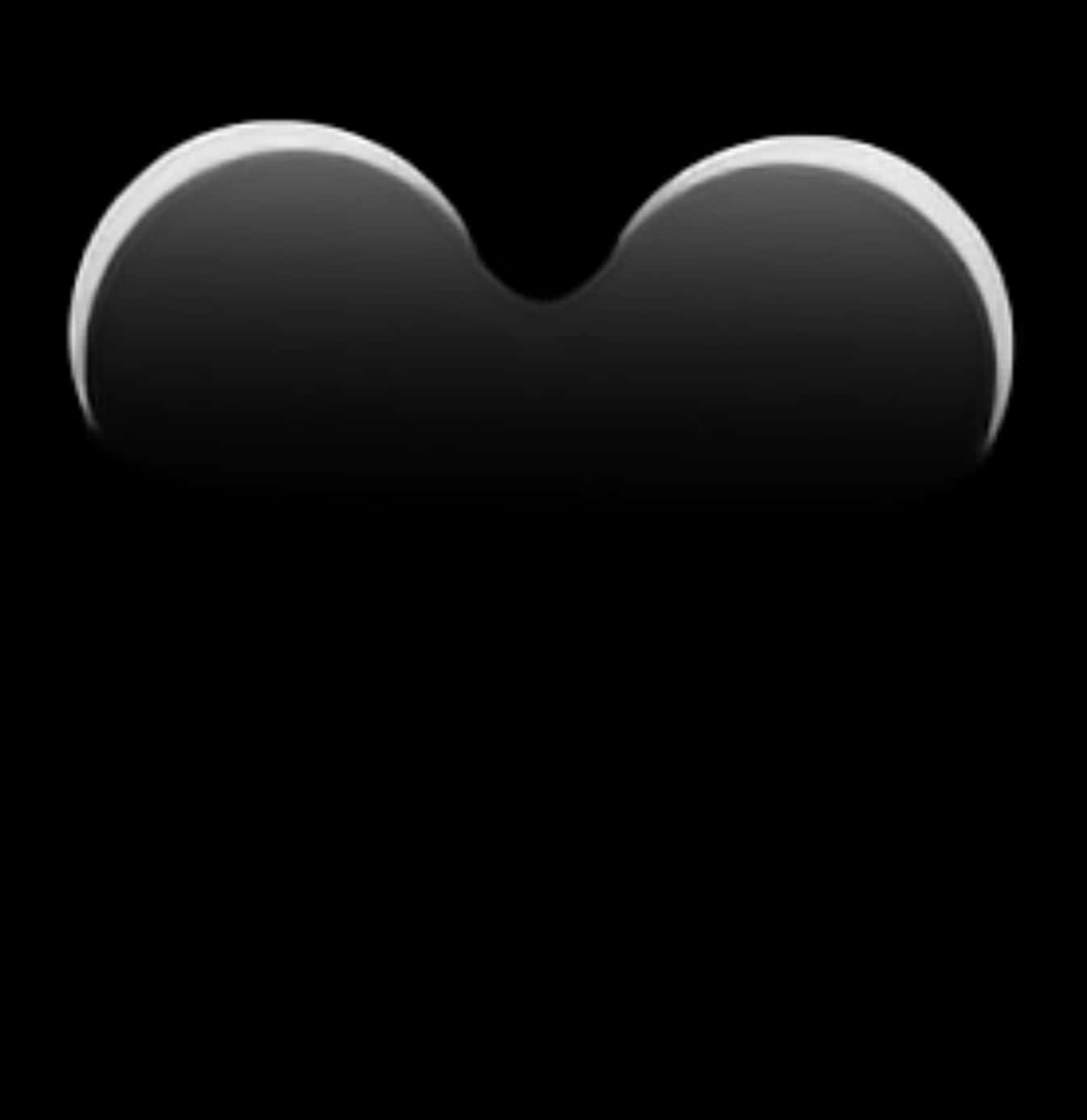 Love Emoji 桌布 壁紙 — 一個極簡的亮面黑色心形，帶有柔和的白色高光，居中於純黑色背景上。