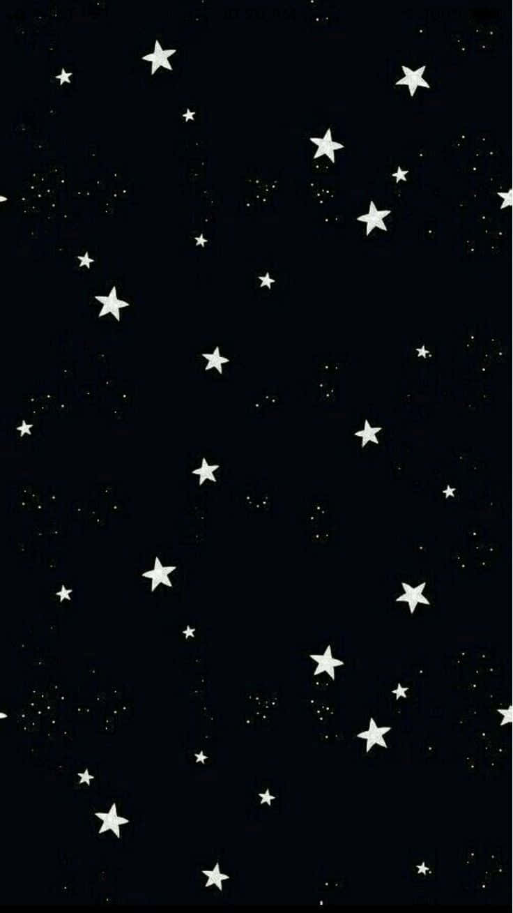 Stars 桌布 壁紙 — 一個極簡的夜空，深黑色背景上散佈著白色的星星和微小的發光點。