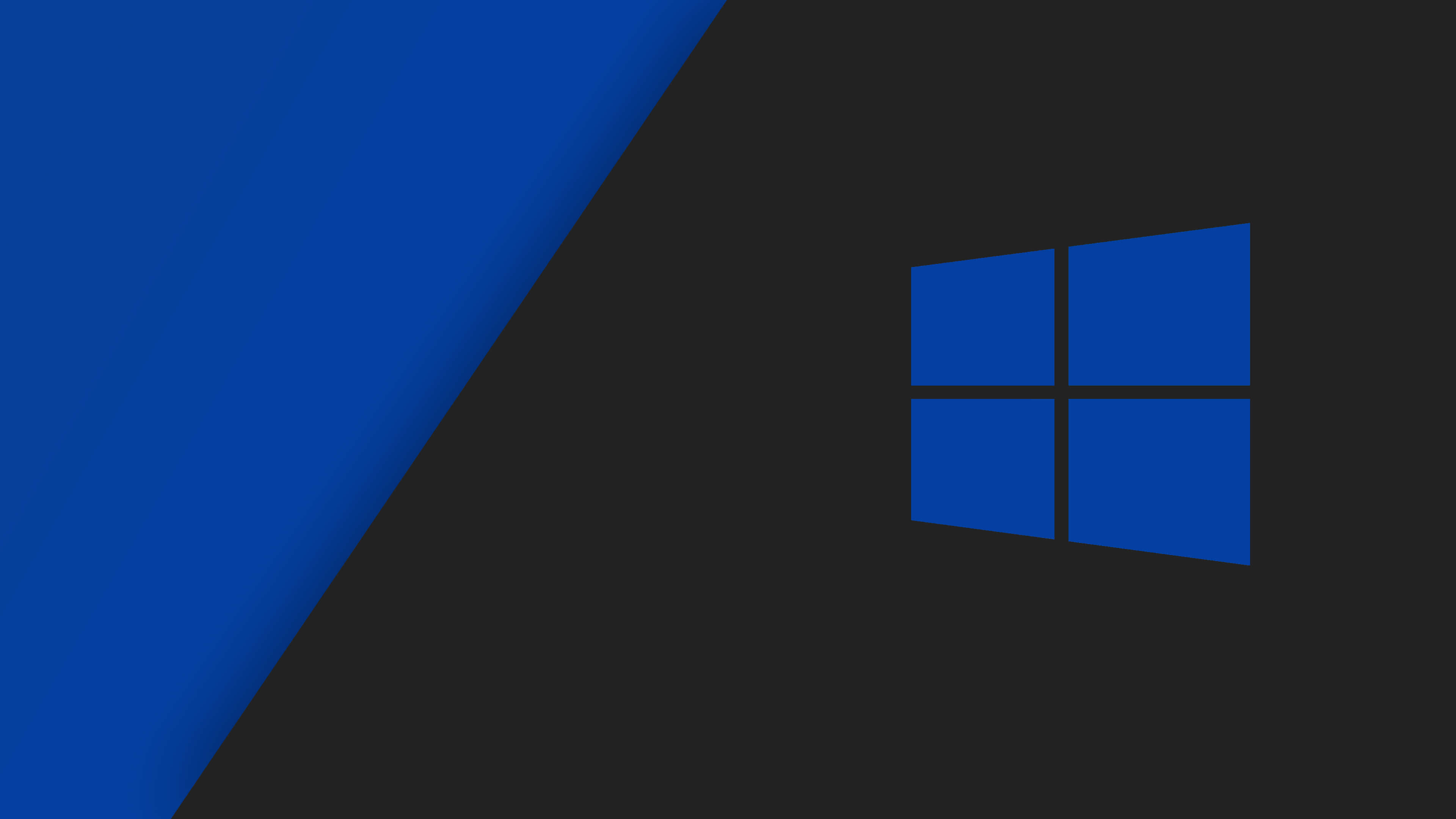 Windows 10 桌布 壁紙 — 一個極簡的數位桌布，在深灰色背景上帶有藍色Windows標誌和對角藍色漸變。