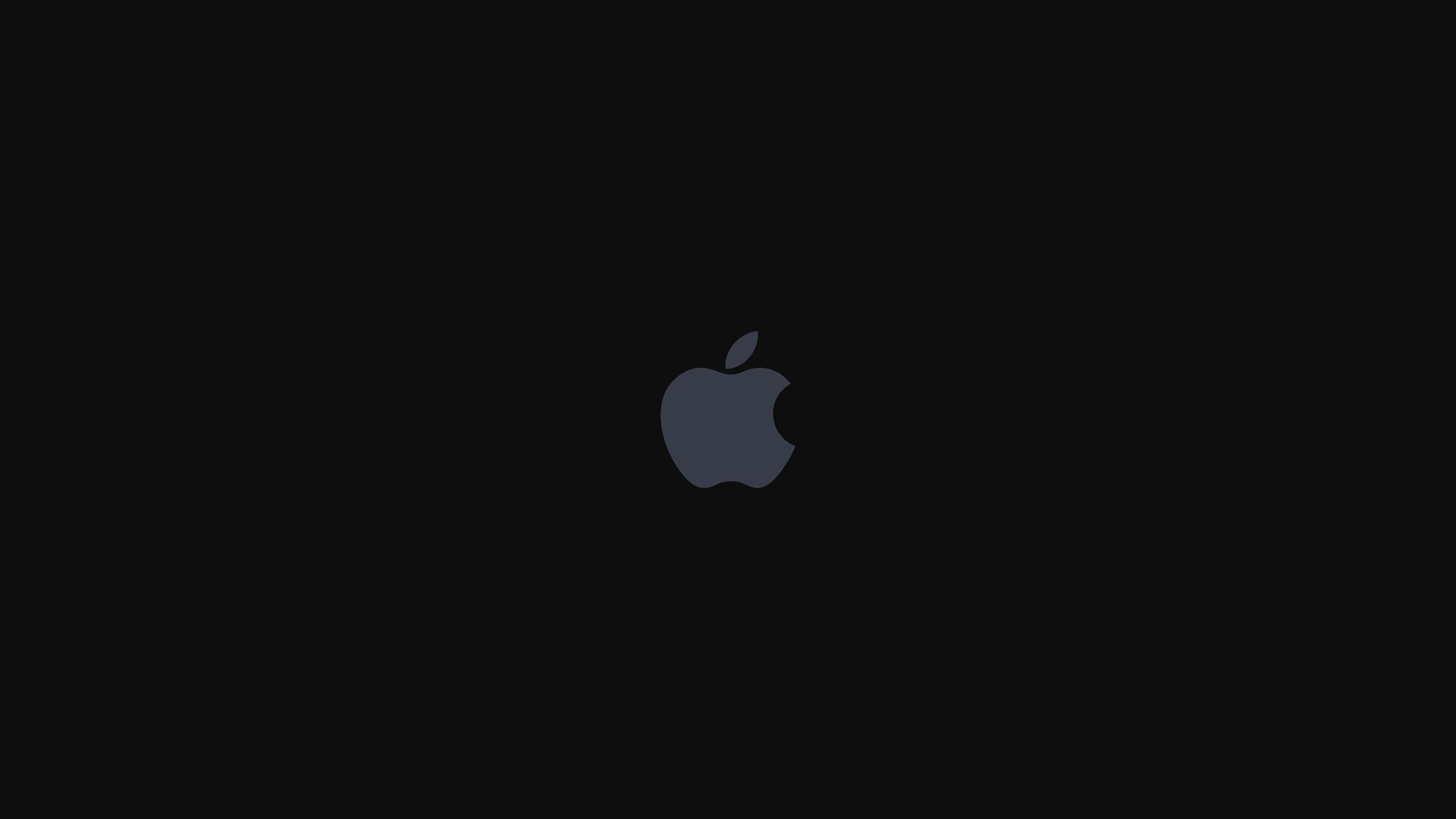 4K Apple 桌布 壁紙 — 一個極簡的深灰色Apple標誌，居中放置在純黑色背景上。
