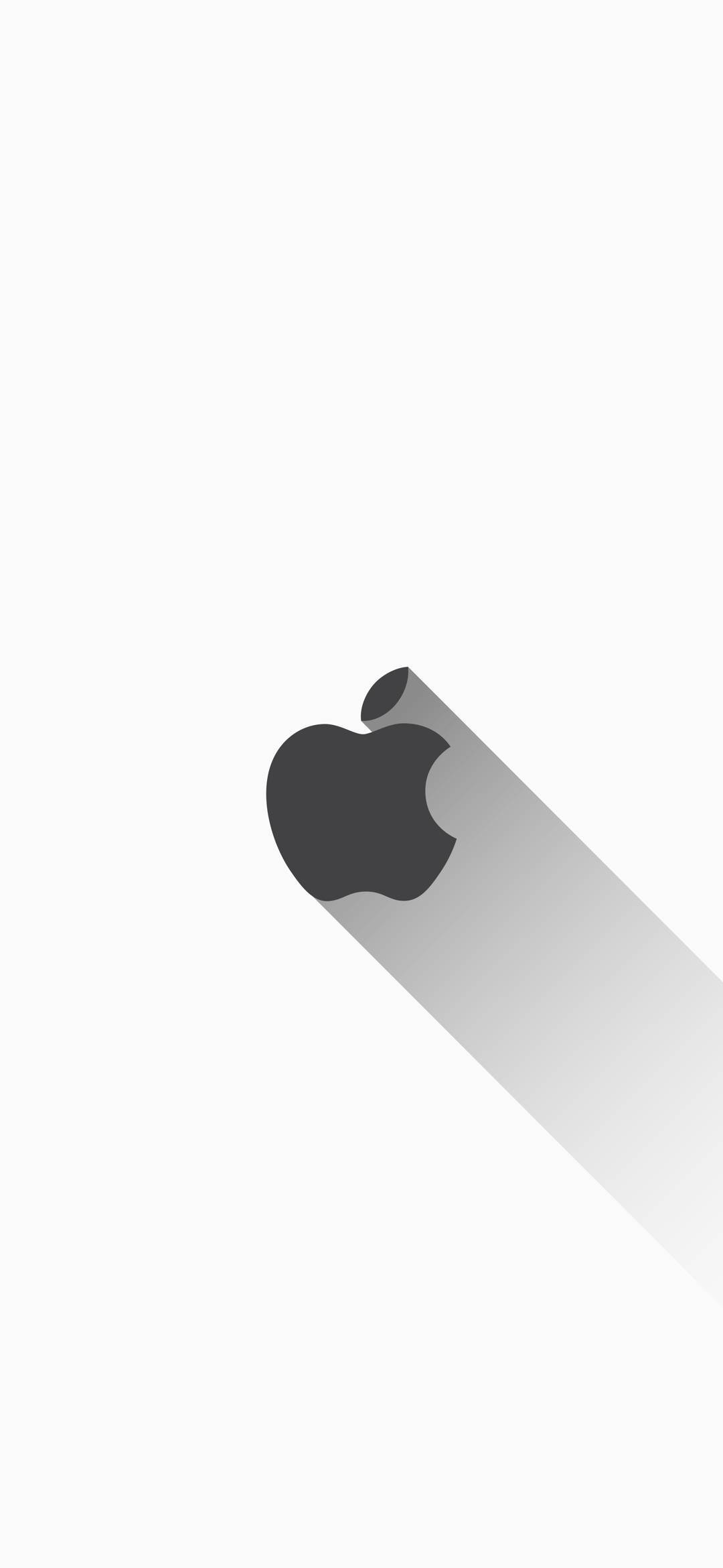 White iPhone 桌布 壁紙 — 一個極簡的深灰色Apple標誌在純白背景上投射出長長的對角線陰影。