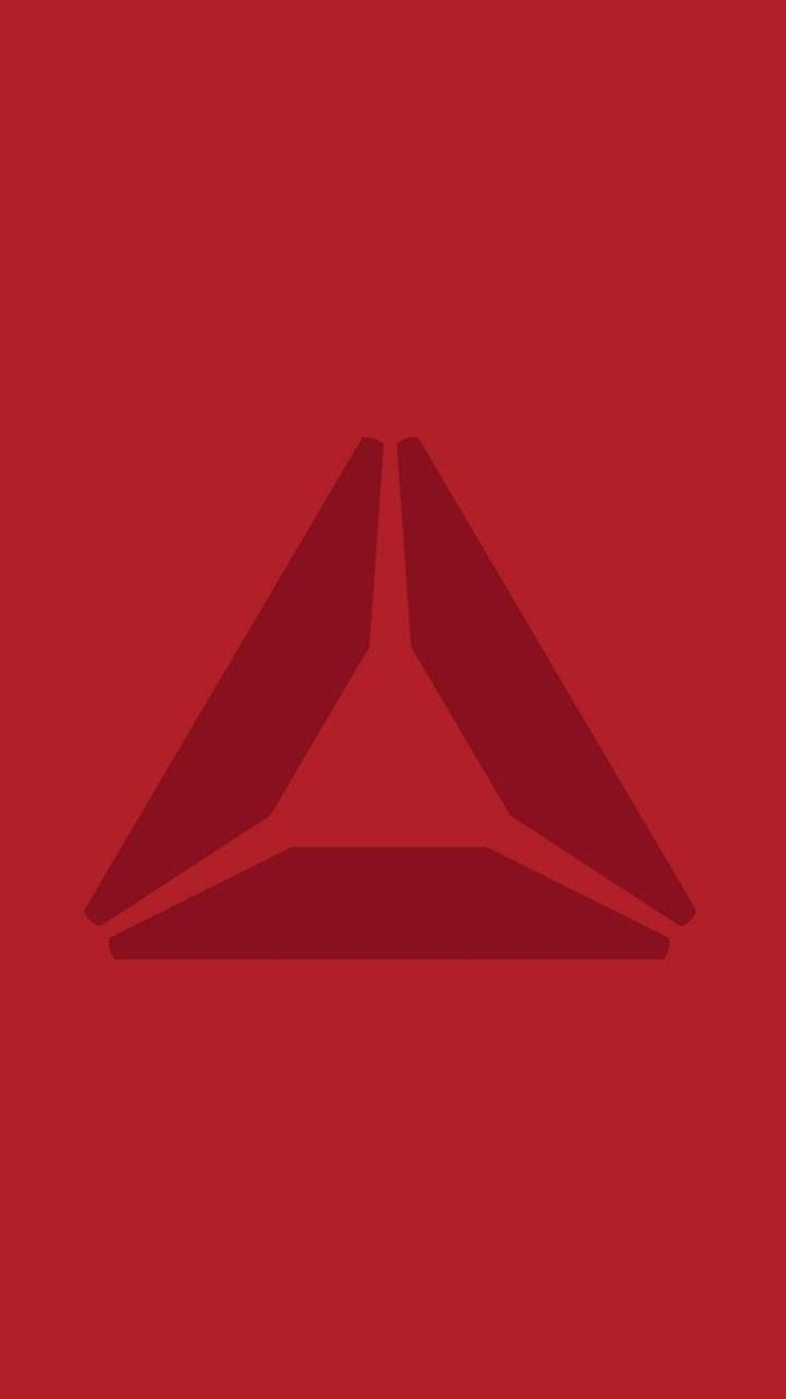 Reebok 桌布 壁紙 — 一個極簡的深紅色三角形標誌，居中於純紅色背景上。