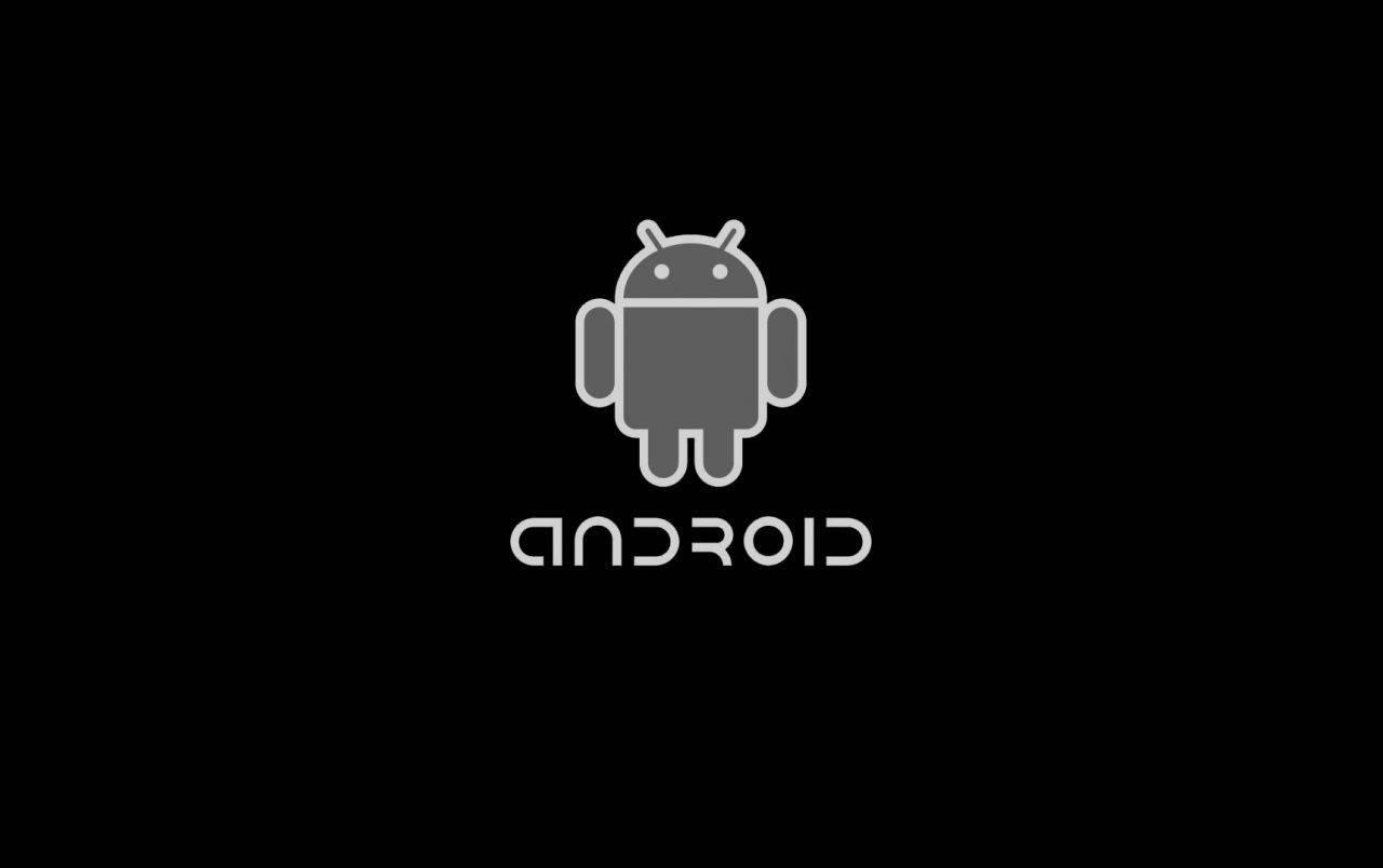Black Android 桌布 壁紙 — 一個極簡的灰色Android機器人標誌，居中於黑色背景上，下方有android字樣。