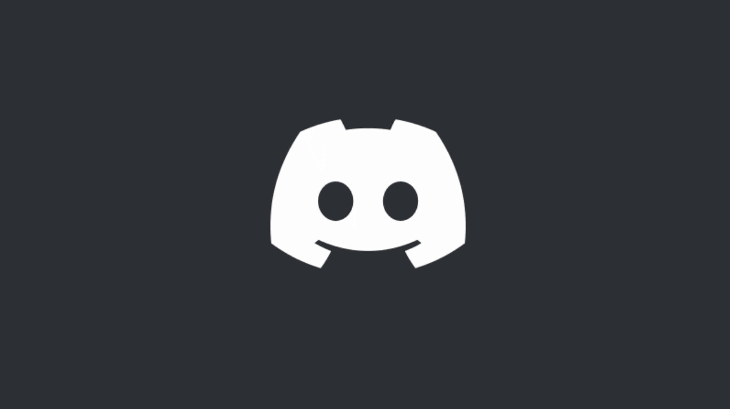Discord 桌布 壁紙 — 一個極簡的白色 Discord 標誌，居中放置在純深灰色背景上。