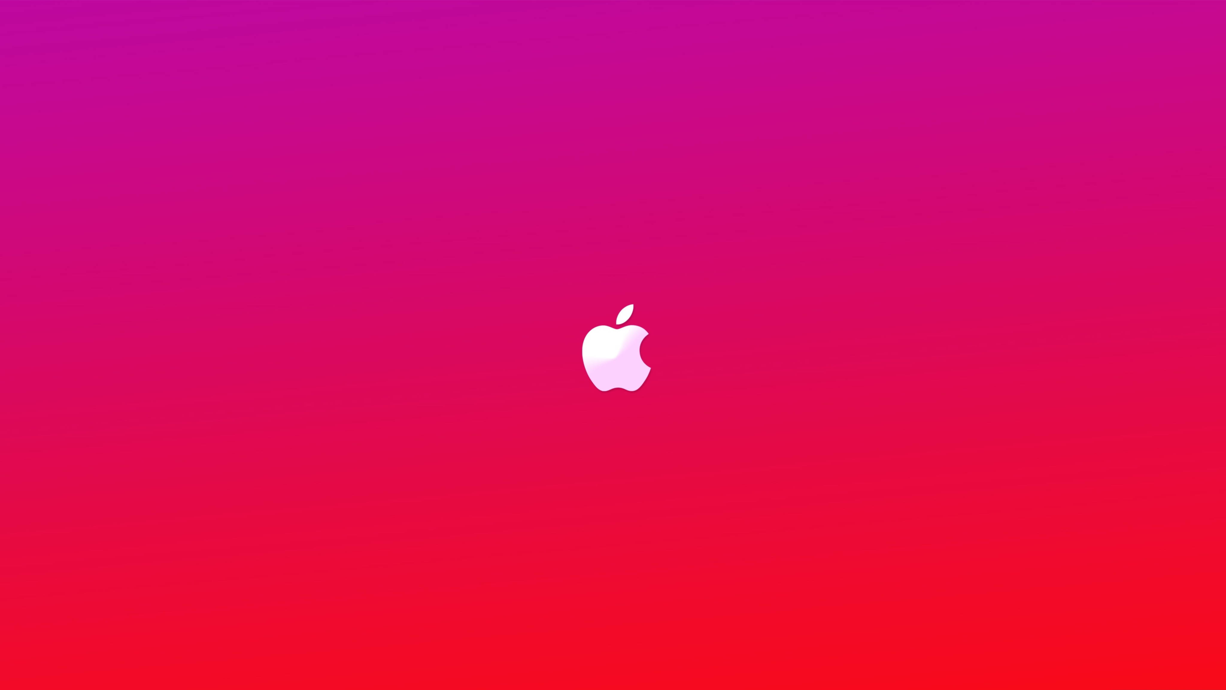 Apple 4K Ultra HD 桌布 壁紙 — 一個極簡的白色Apple標誌，居中於從洋紅色過渡到紅色的鮮豔漸變背景上。