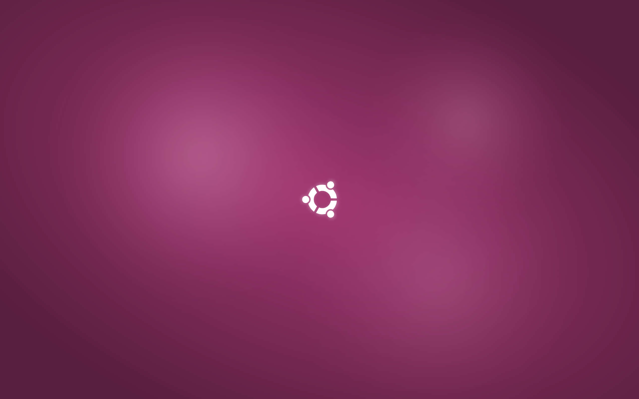 ubuntu 桌布 壁紙 — 一個極簡的白色Ubuntu標誌，居中於帶有柔和光效的洋紅色漸變背景上。