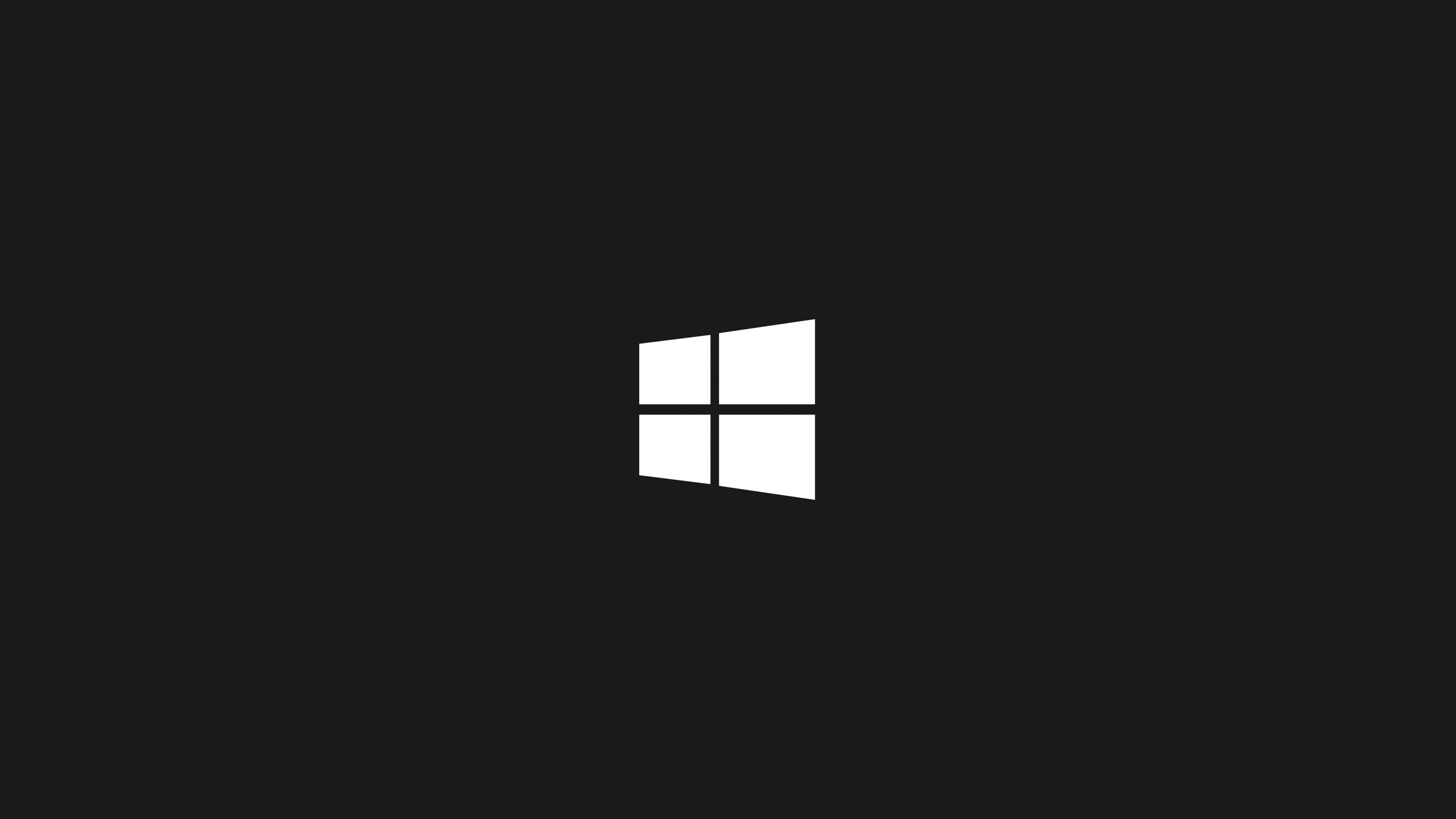 Windows 10 高畫質 桌布 壁紙 — 一個極簡的白色Windows標誌居中在純黑色背景上。