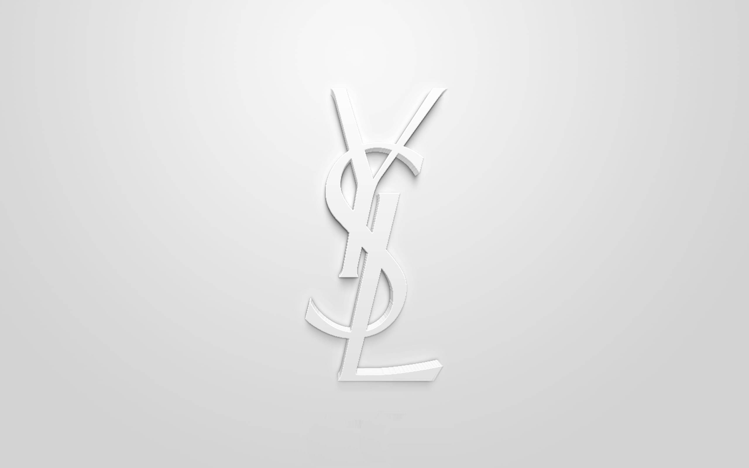 Ysl 桌布 壁紙 — 一個極簡的白色YSL字母組合標誌，在柔和的灰色漸變背景上居中展示，帶有微妙的燈光效果。