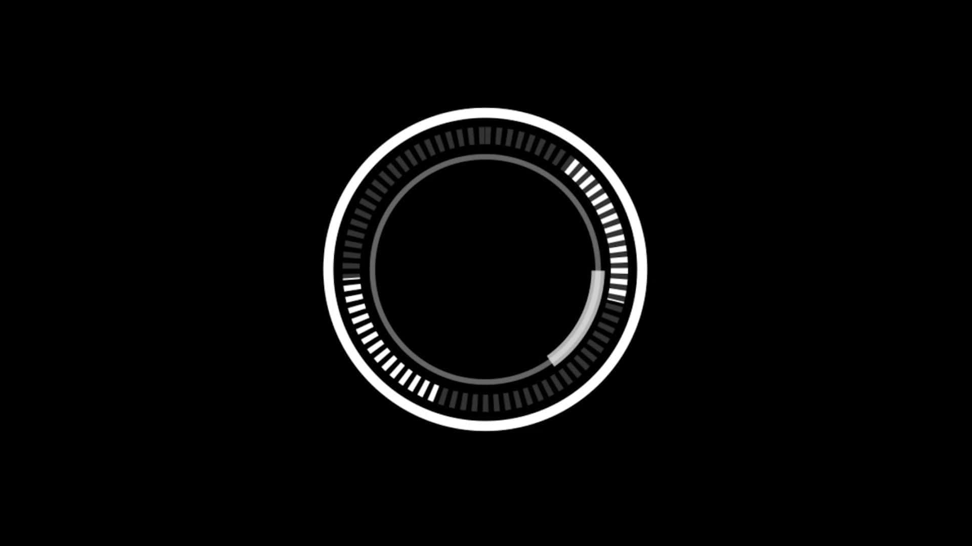 Video Buffering 桌布 壁紙 — 一個極簡的白色圓形進度條，帶有刻度標記，在純黑色背景上旋轉。