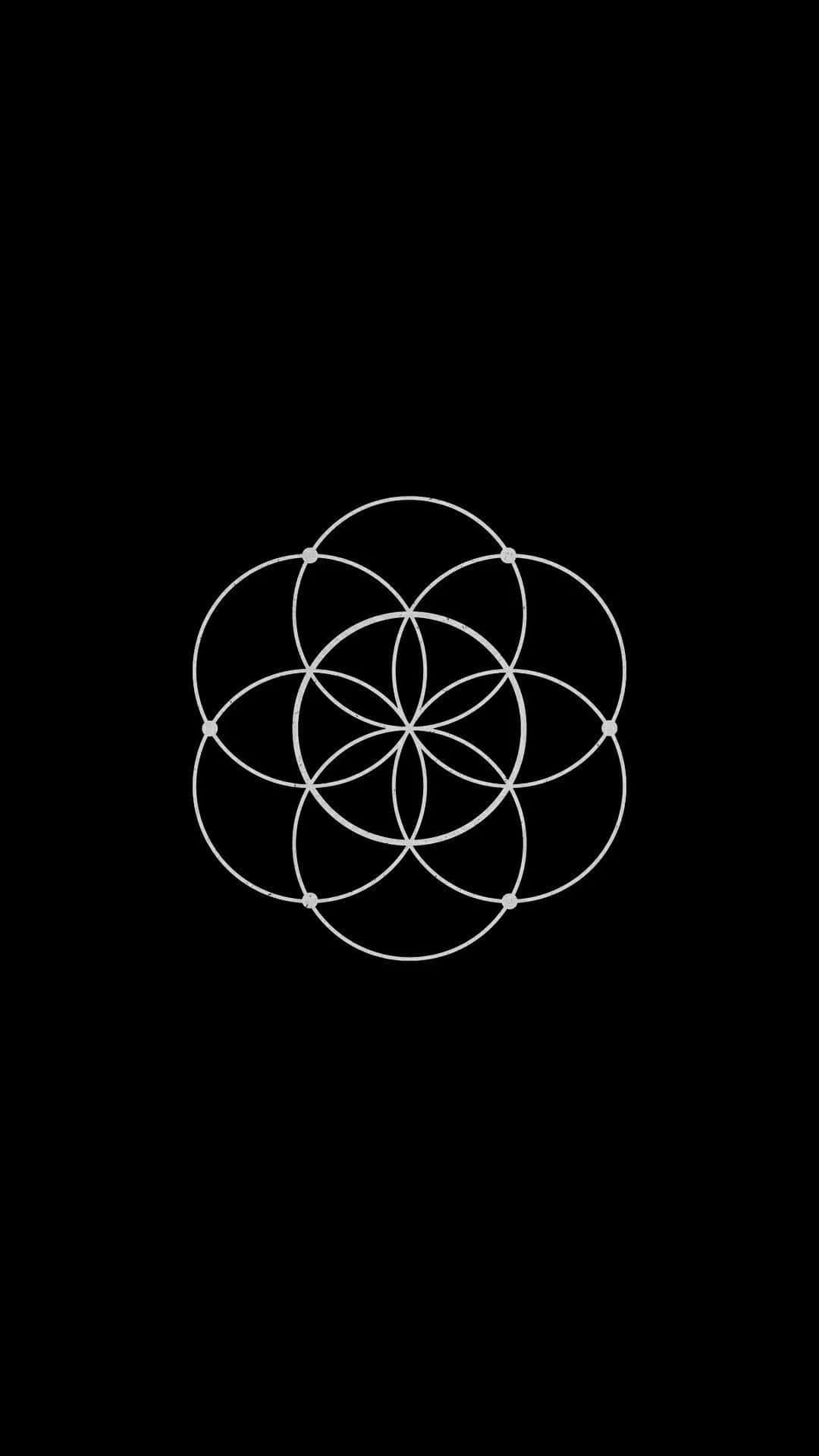 Symbolism 桌布 壁紙 — 一個極簡的白色生命之花幾何符號，居中放置在純黑色背景上。