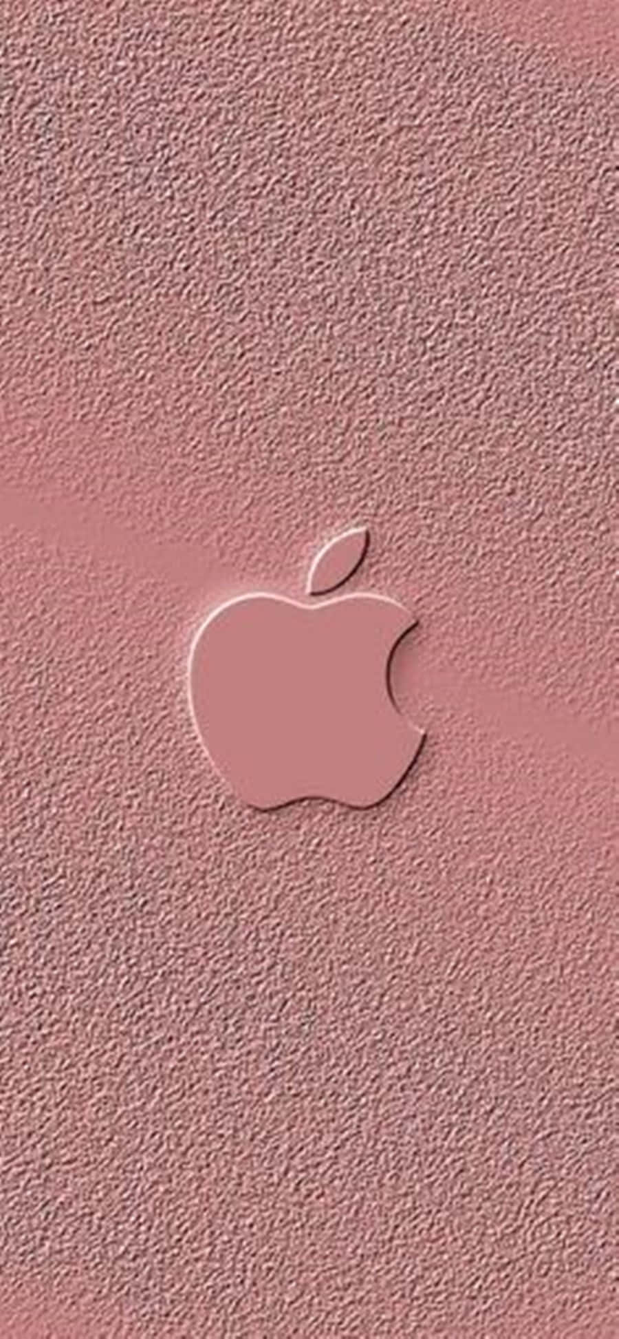 玫瑰金 桌布 壁紙 — 一個極簡的粉紅色Apple標誌，壓印在帶有紋理的霧面粉紅色背景上。