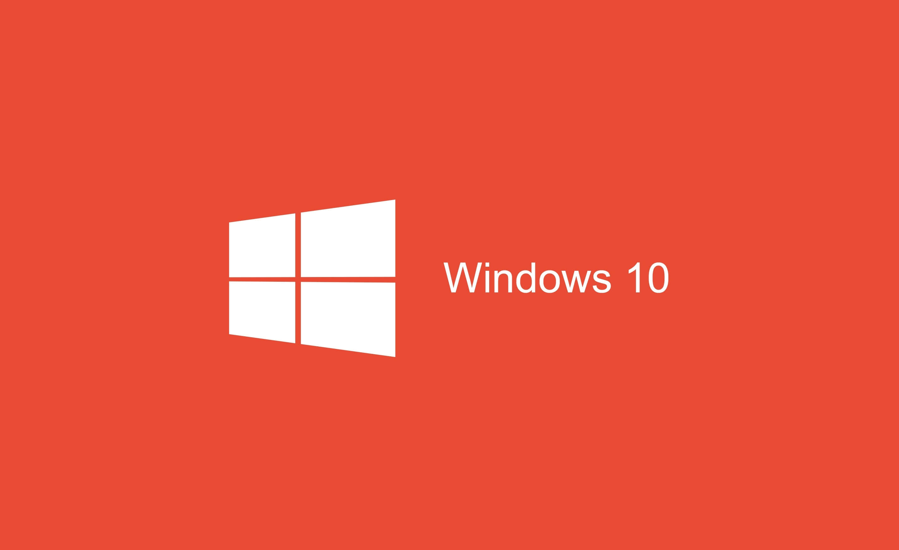 Windows 10 Desktop 桌布 壁紙 — 一個極簡的紅色背景，白色Windows 10標誌和文字顯眼地居中顯示。