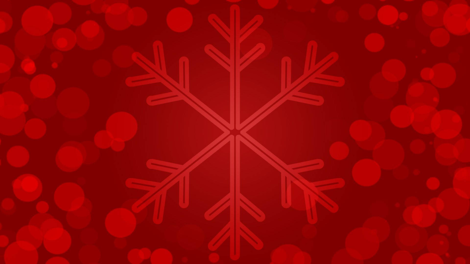 聖誕節 桌布 壁紙 — 一個極簡的紅色雪花輪廓在充滿活力的紅色散景背景中發光。
