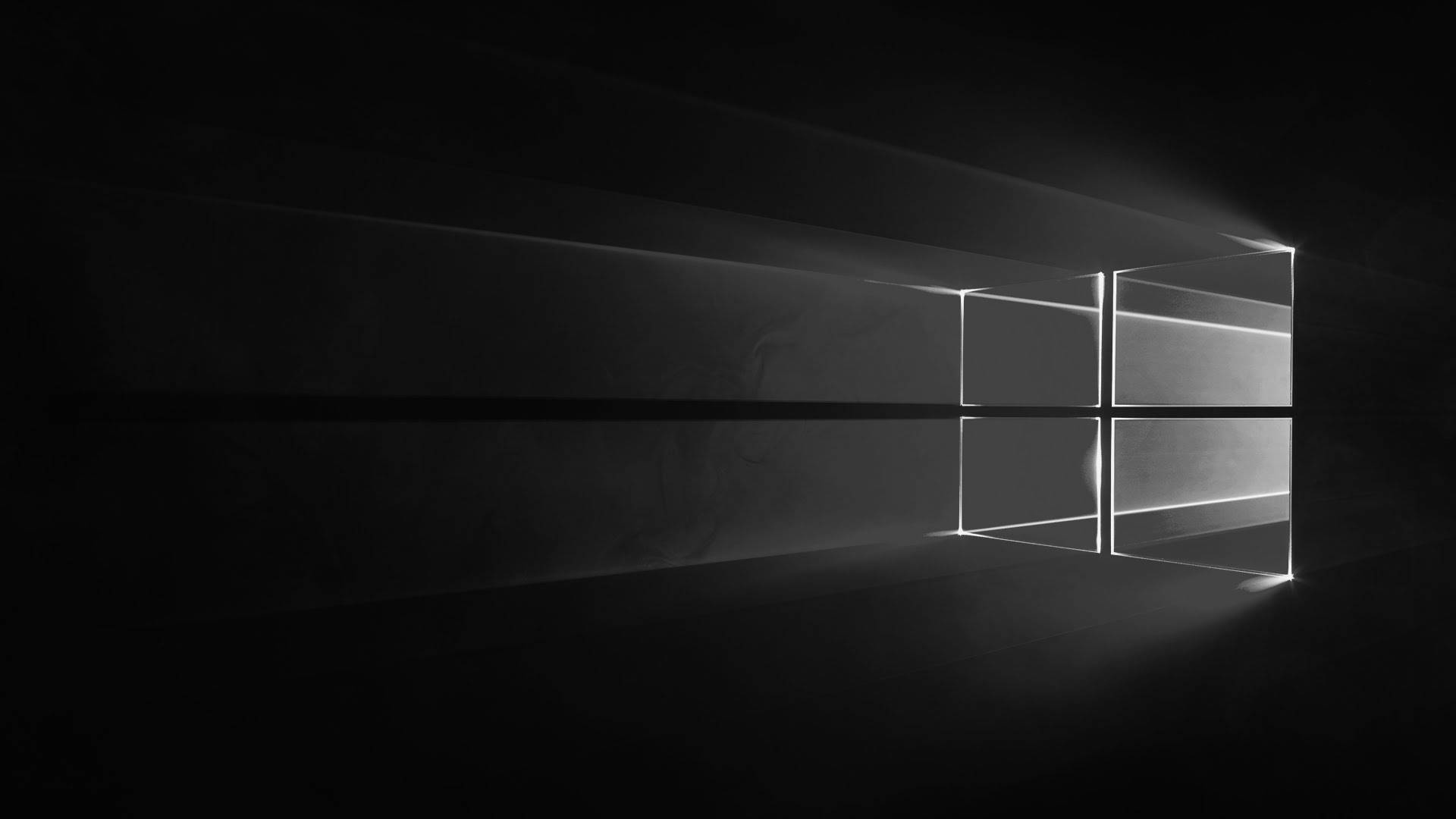 黑色 Windows 10 桌布 壁紙 — 一個極簡的黑白窗戶剪影，明亮的燈光穿透黑暗的空氣。