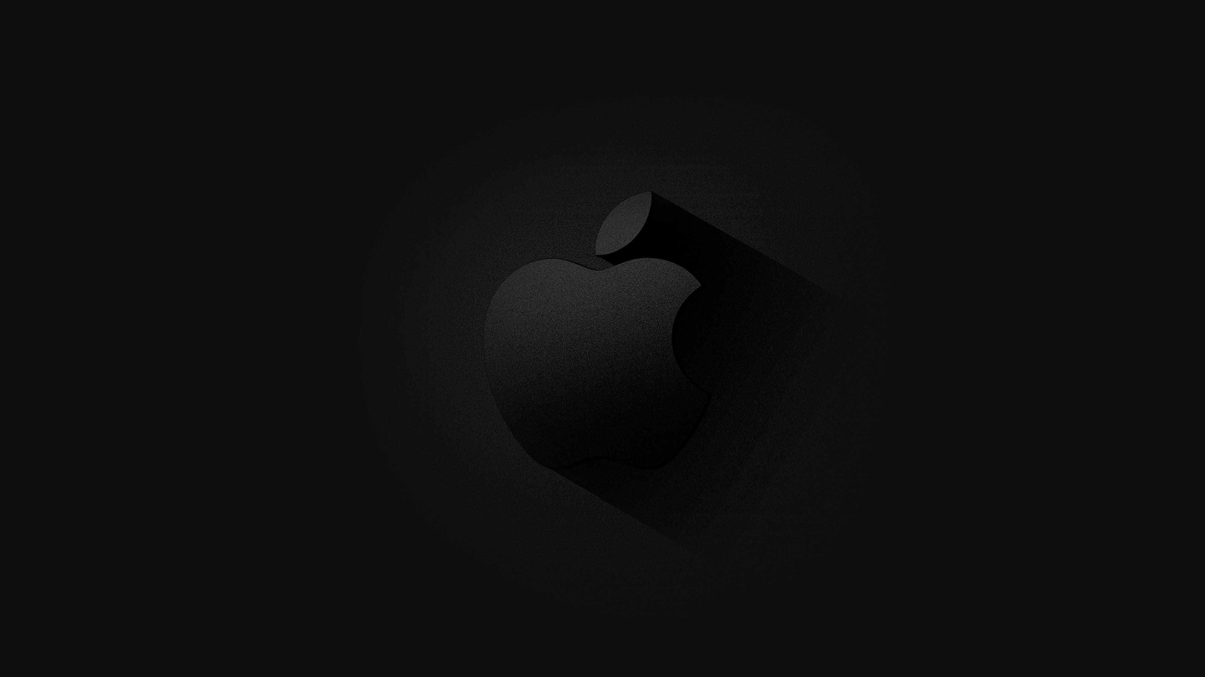 4K 桌布 壁紙 — 一個極簡的黑色Apple標誌，帶有長陰影，居中在深色漸變背景上。