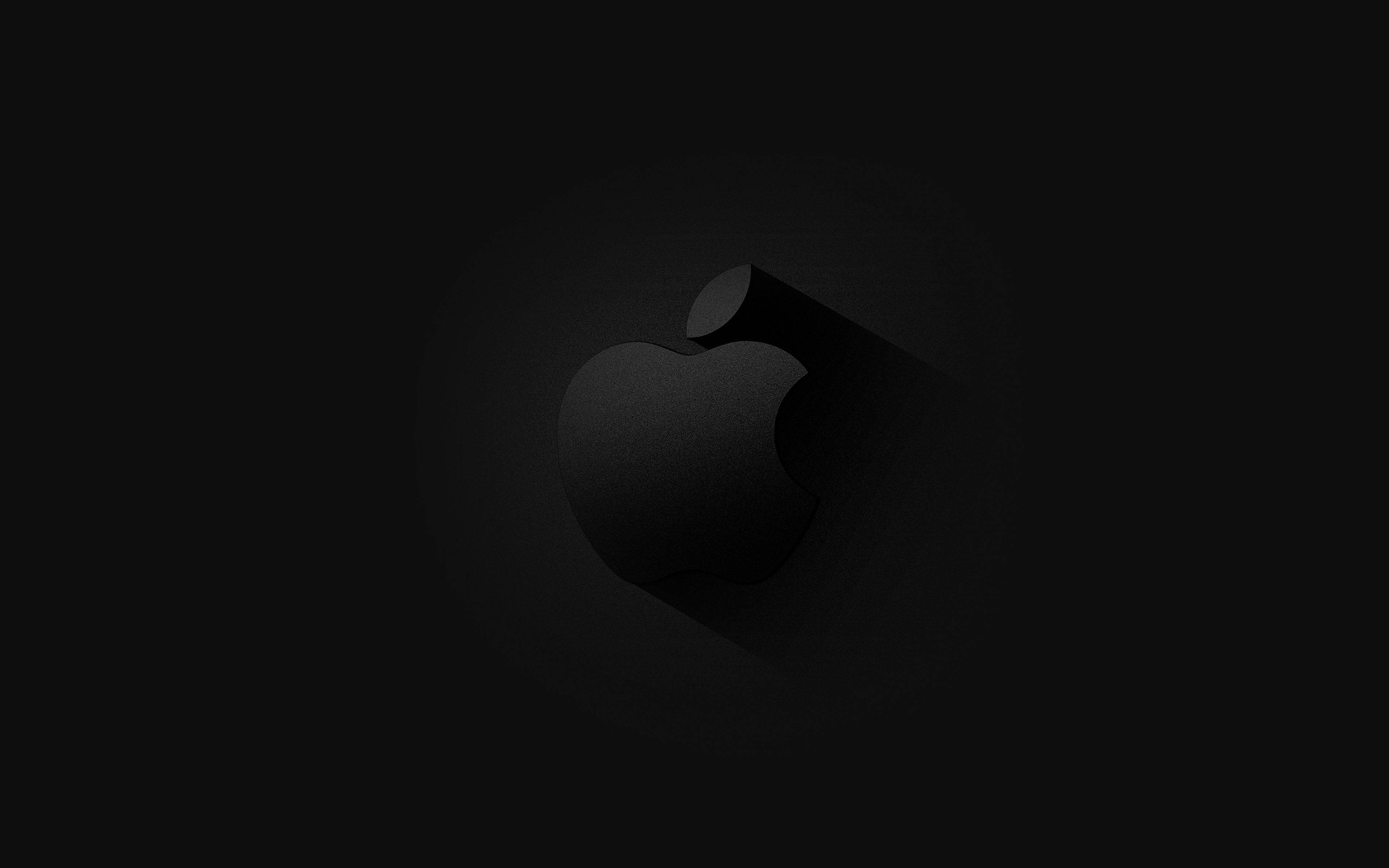 MacBook 動態圖片 桌布 壁紙 — 一個極簡的黑色Apple標誌，帶有微妙的漸變和陰影效果，居中放置在深色背景上。