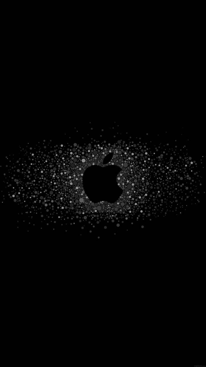 iPhone 桌布 壁紙 — 一個極簡的黑色Apple標誌從純黑色背景上散落的發光白色點陣中浮現。