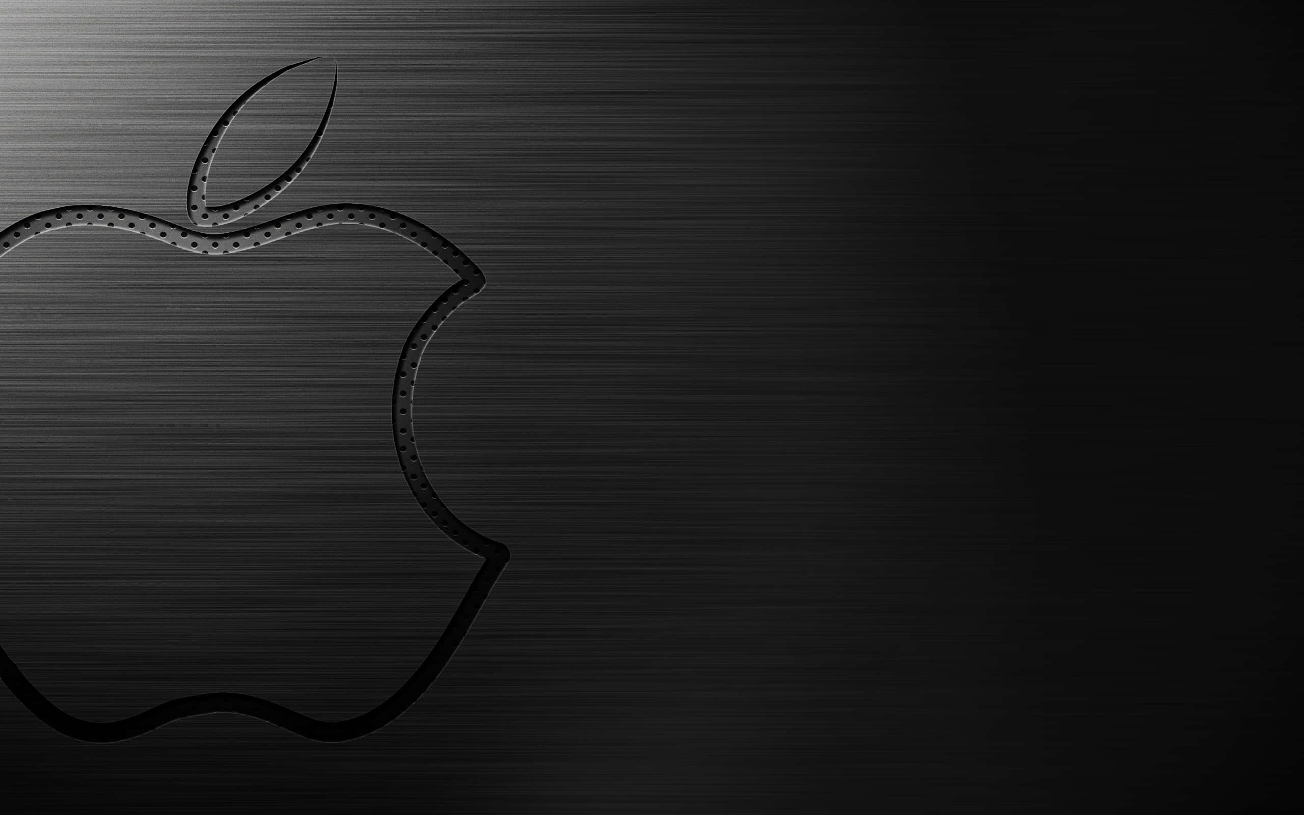 桌布 壁紙 — 一個極簡的黑色Apple標誌蝕刻在拉絲金屬上，帶有微妙的燈光漸變。