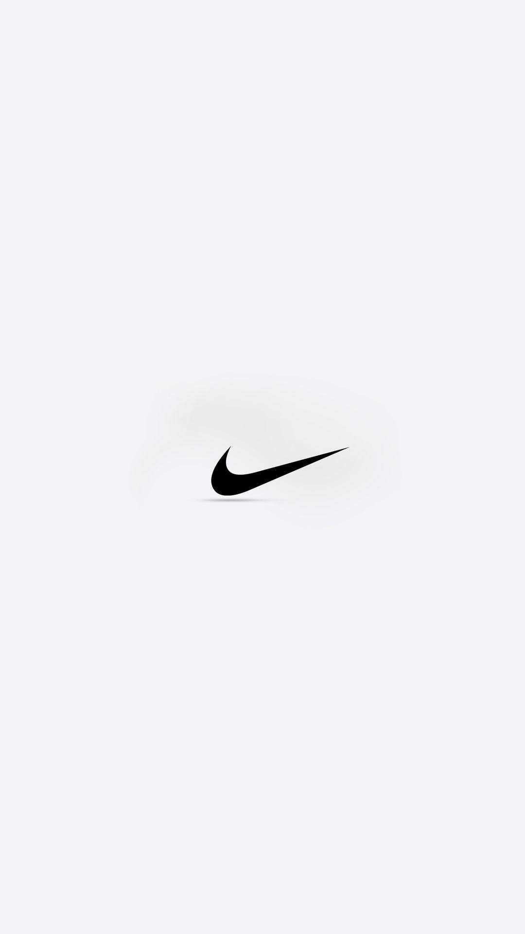 淺灰色背景上的黑色Nike勾號標誌 — Nike GIF 壁紙
