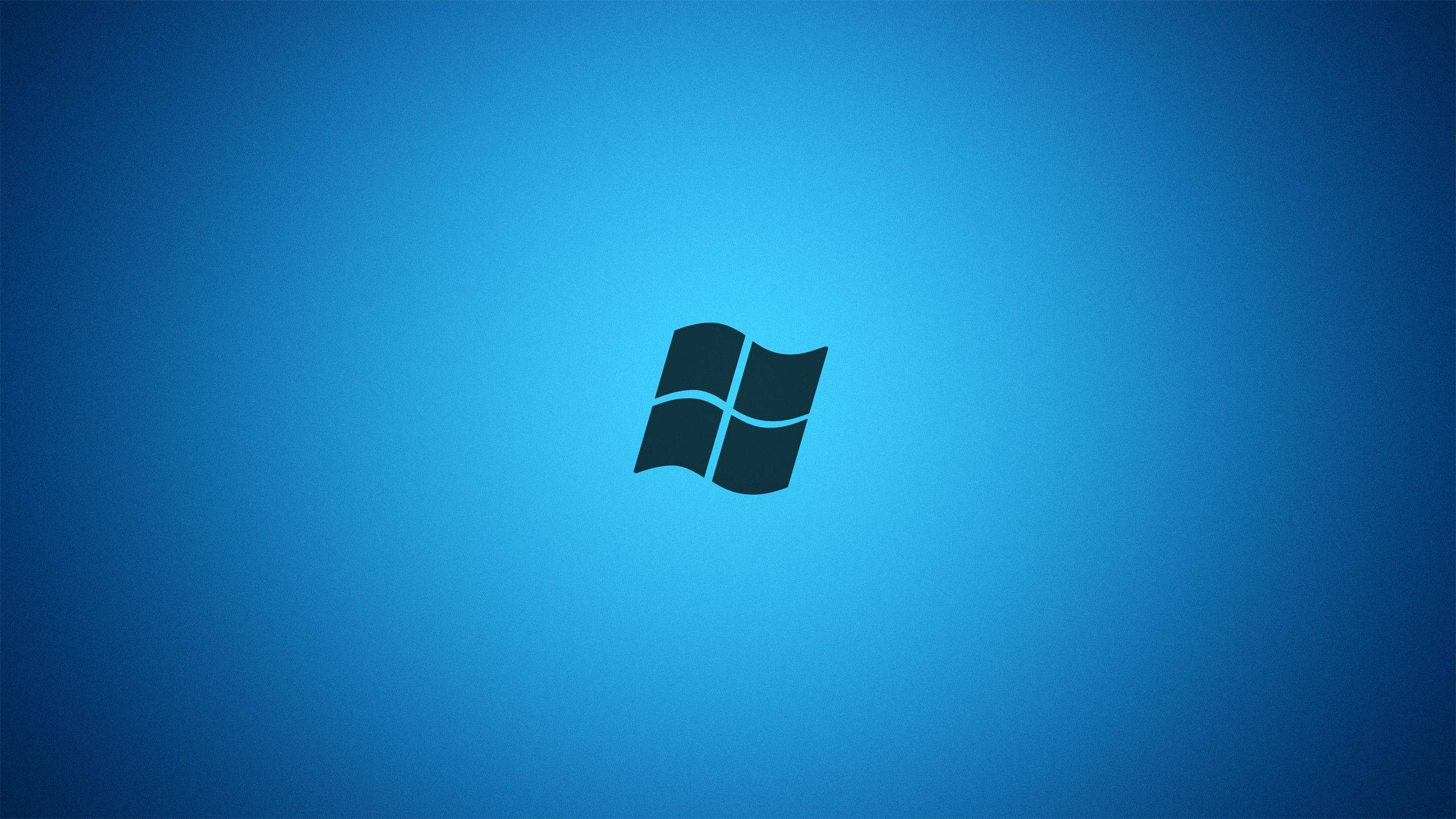 Windows 桌布 壁紙 — 一個極簡的黑色Windows標誌，居中在漸變藍色背景上。