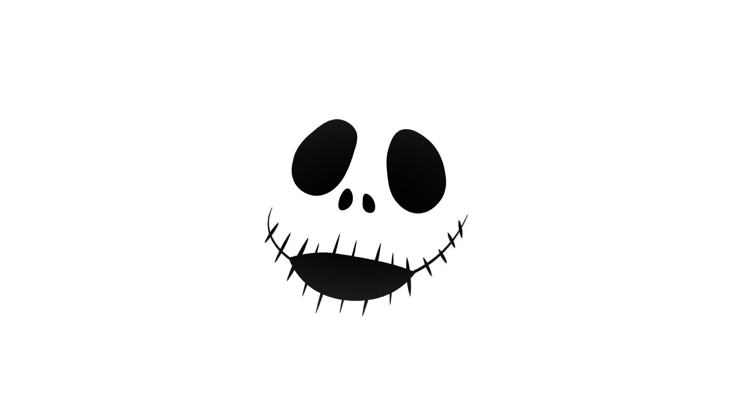 Jack Skellington 桌布 壁紙 — 一個極簡的黑色縫線笑臉，有大橢圓眼睛和小鼻子，在純白背景上。