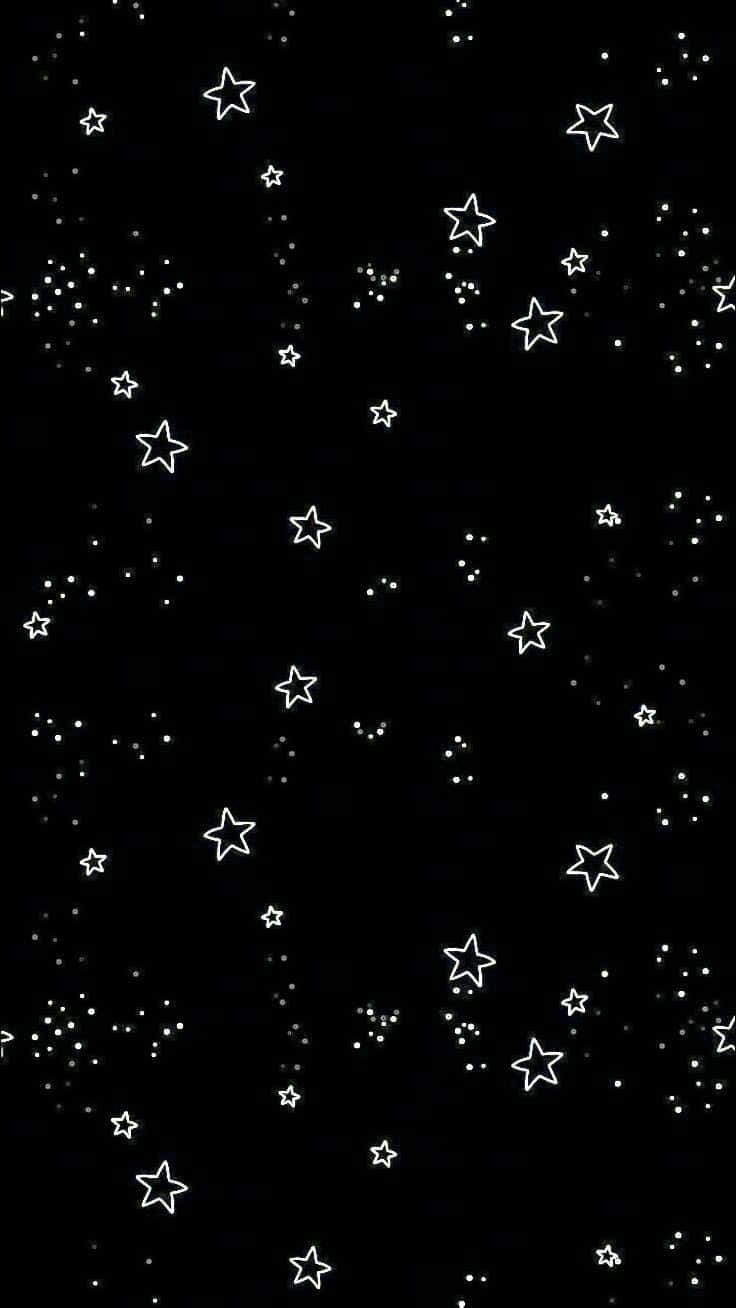 Stars 桌布 壁紙 — 一個極簡的黑色背景，點綴著散落的白色輪廓星星和微小點點，宛如宇宙夜空。