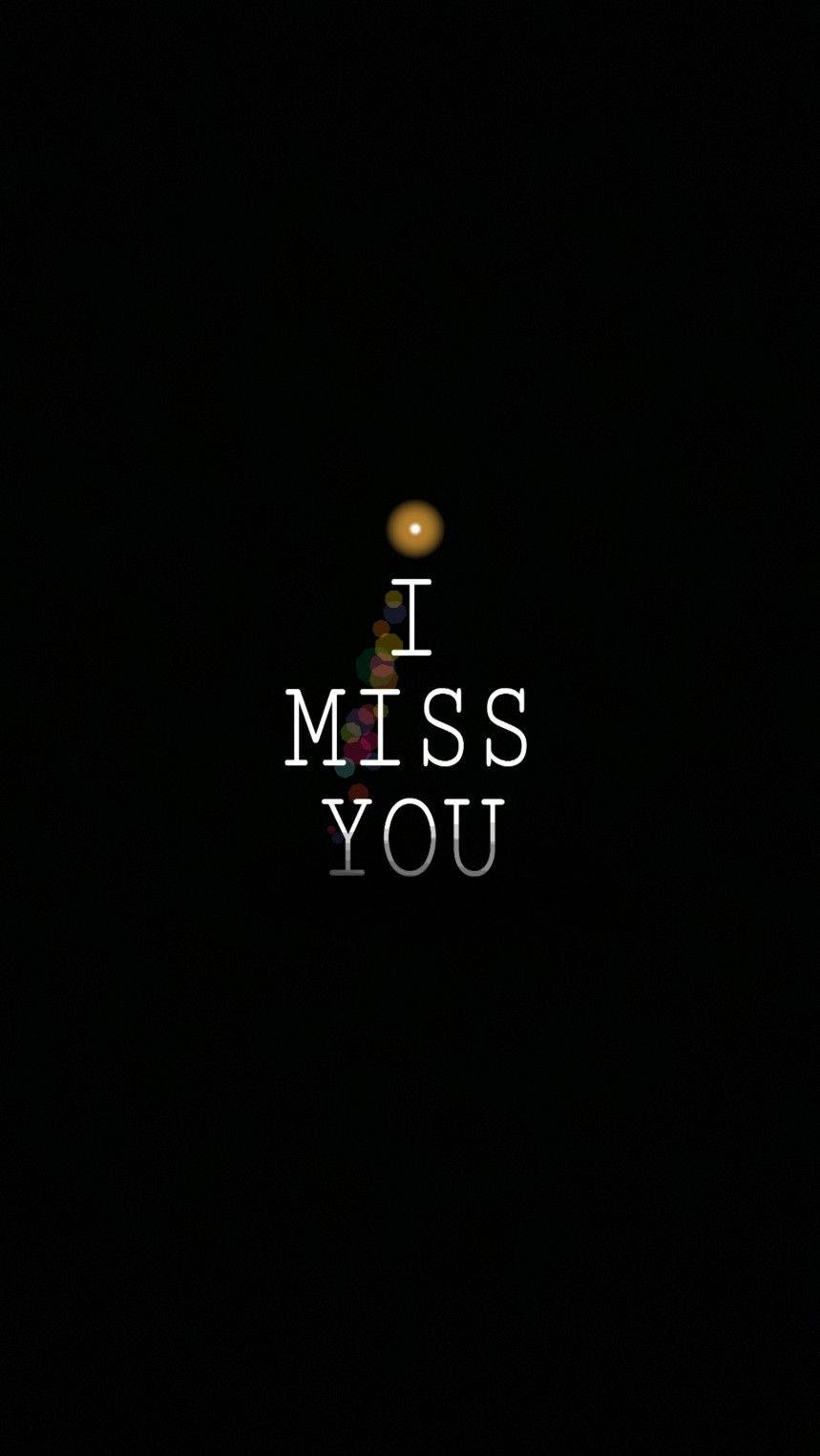Missing 桌布 壁紙 — 一個極簡的黑色背景上，白色文字顯示「I MISS YOU」，上方有一個發光的球體，傳達思念之情。
