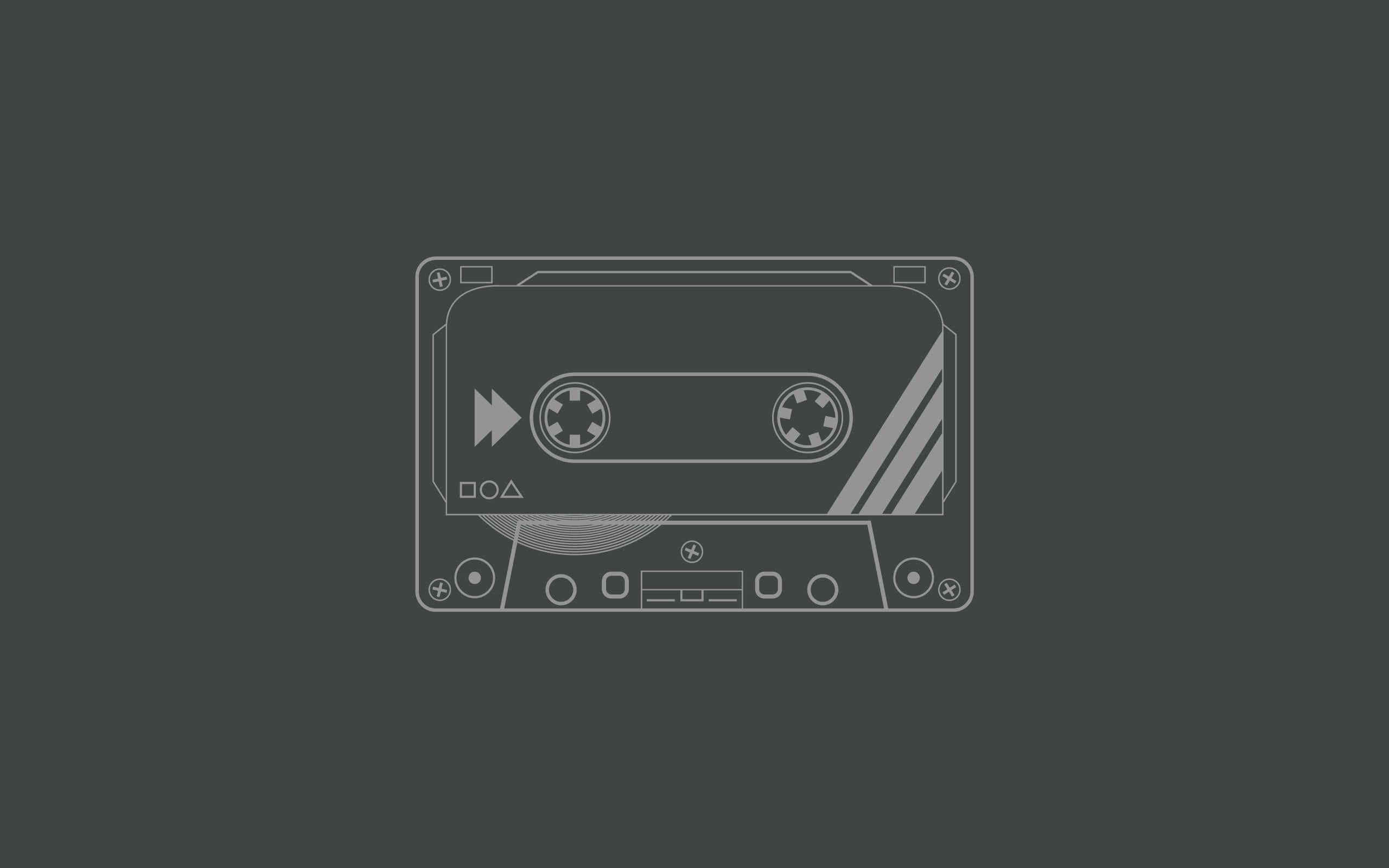 Minimalist Gray 桌布 壁紙 — 一個極簡線條藝術卡式錄音帶圖示，居中放置在深灰色背景上。