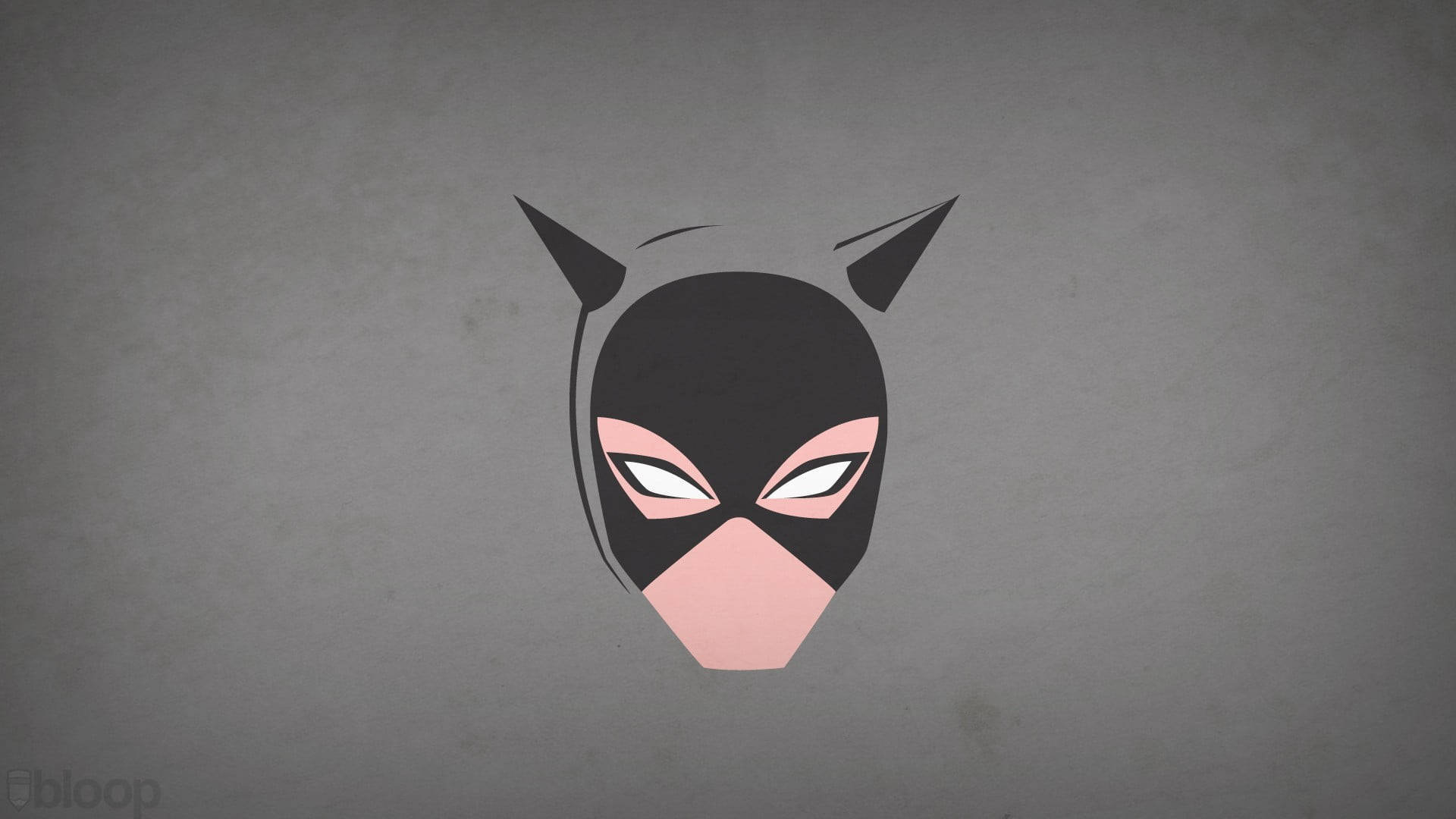 Catwoman 桌布 壁紙 — 一個極簡風格、帶有粉紅色點綴的貓女面具，置於有紋理的灰色背景中央。
