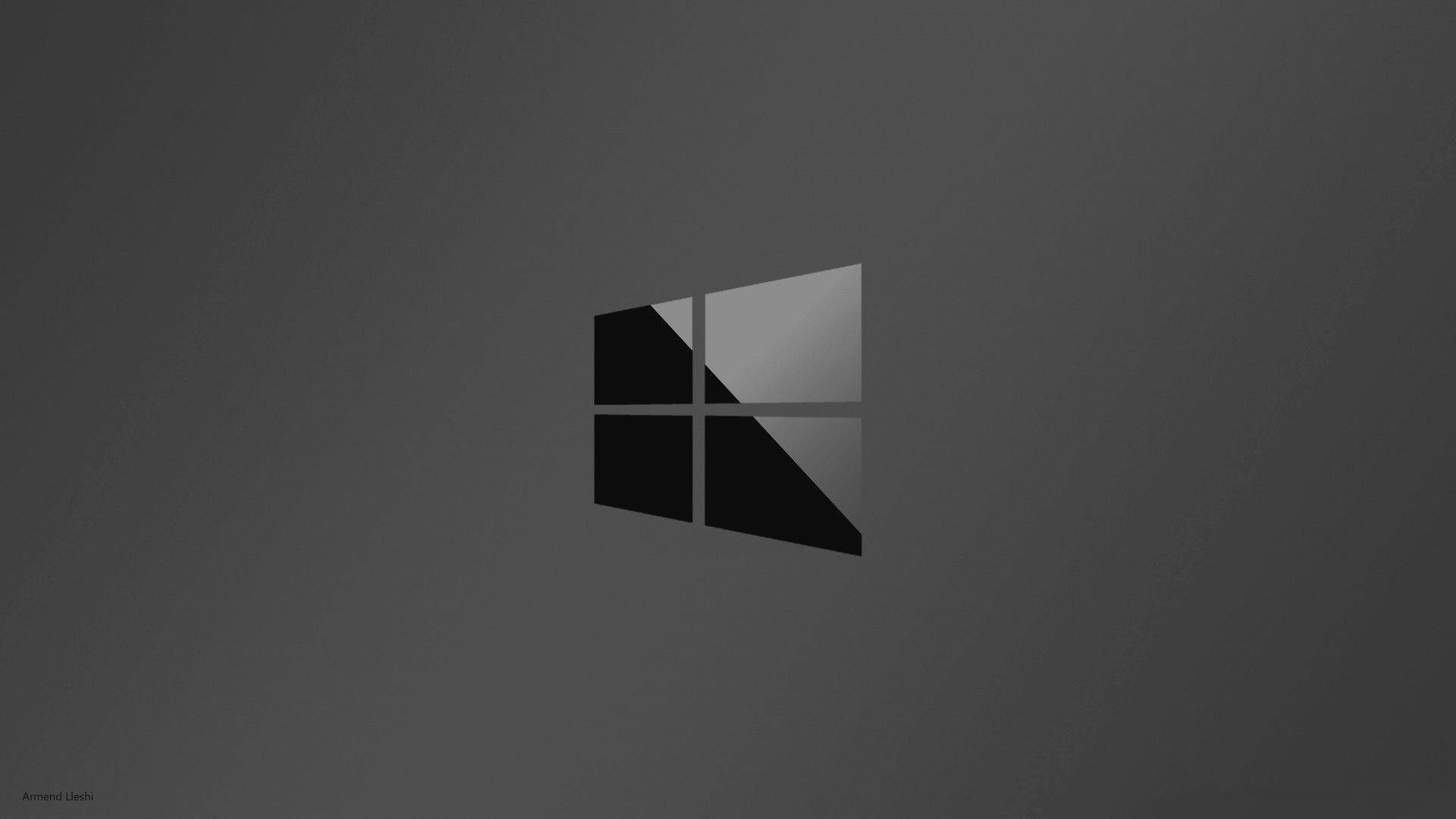 black windows 10 HD 桌布 壁紙 — 一個極簡風格的Windows標誌，黑色和灰色面板居中放置在深灰色漸變背景上。