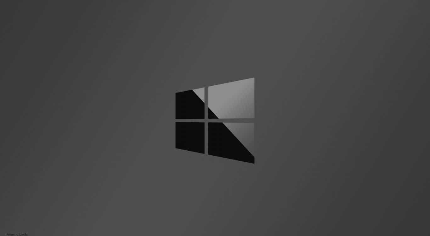 Black Windows 桌布 壁紙 — 一個極簡風格的Windows標誌，以黑色和灰色色調呈現，居中放置在灰色漸變背景上。