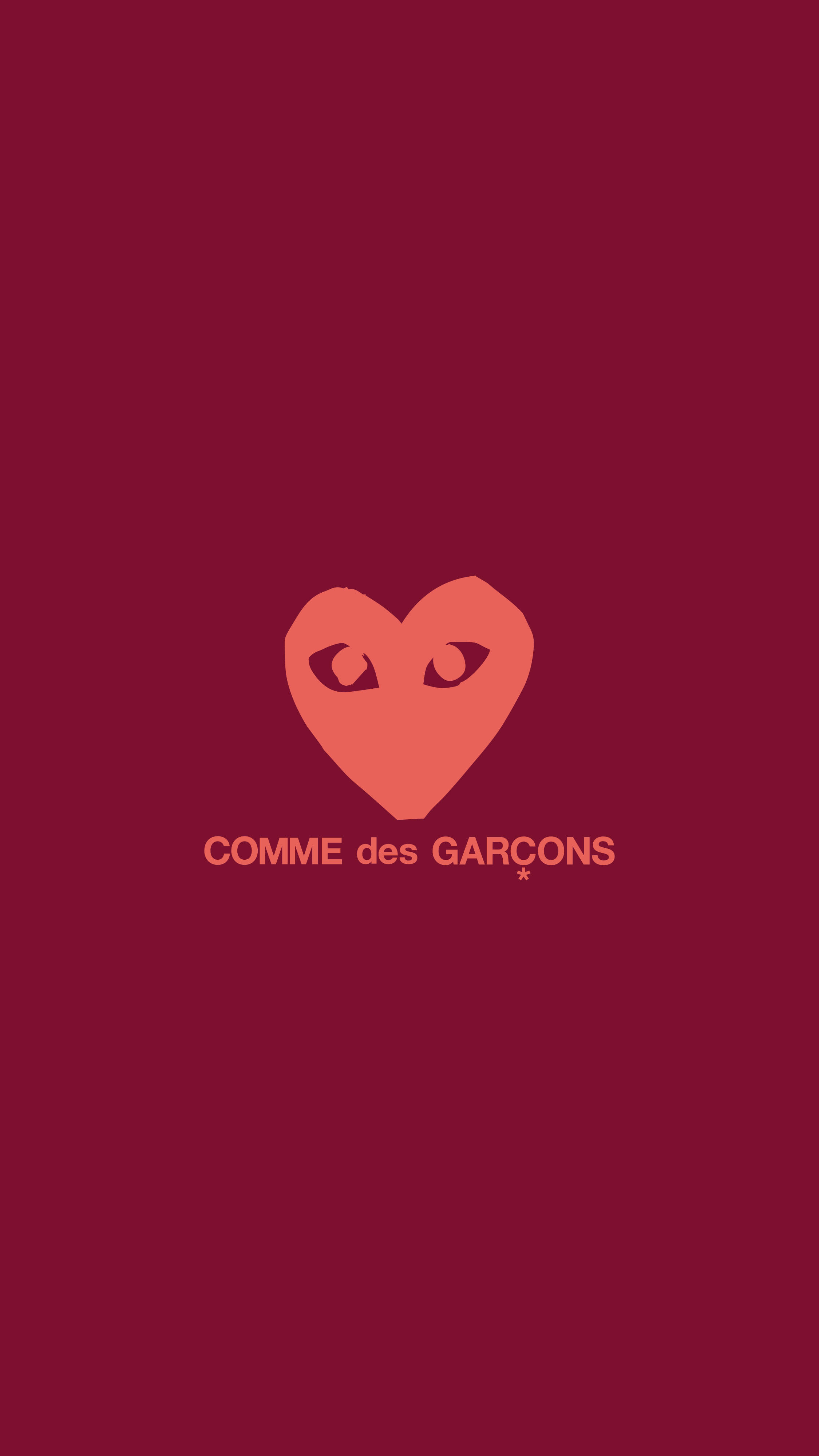 cdg 桌布 壁紙 — 一個極簡風格的珊瑚心形標誌，帶有眼睛，居中在深紅色背景上，下方有品牌文字。