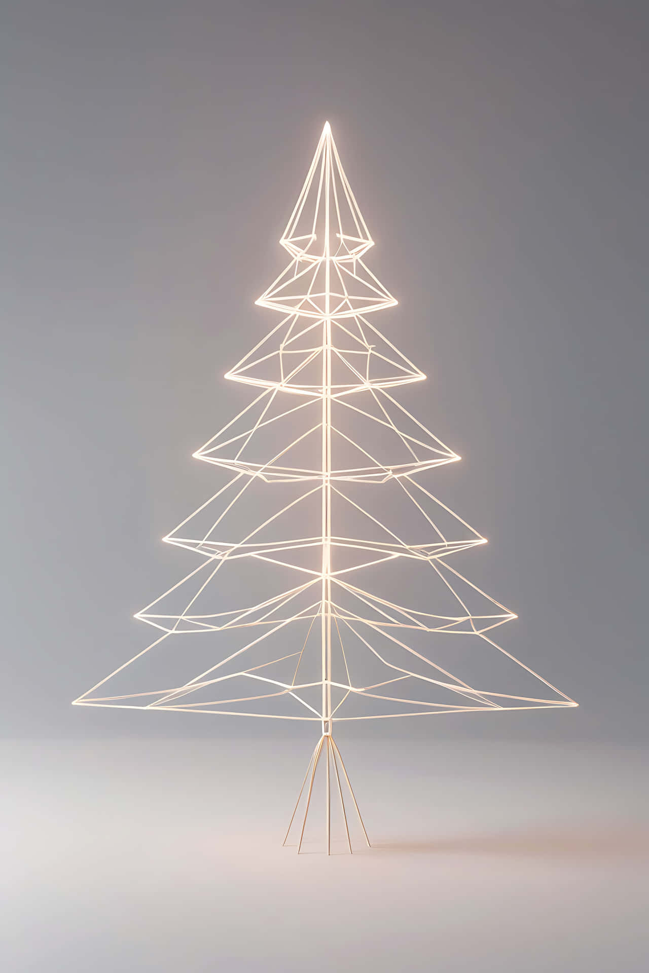 Modern geometric christmas tree 壁紙 — 一個極簡風格的發光線框聖誕樹，立在柔和的灰色背景上，溫暖的光芒從其幾何結構中散發出來。