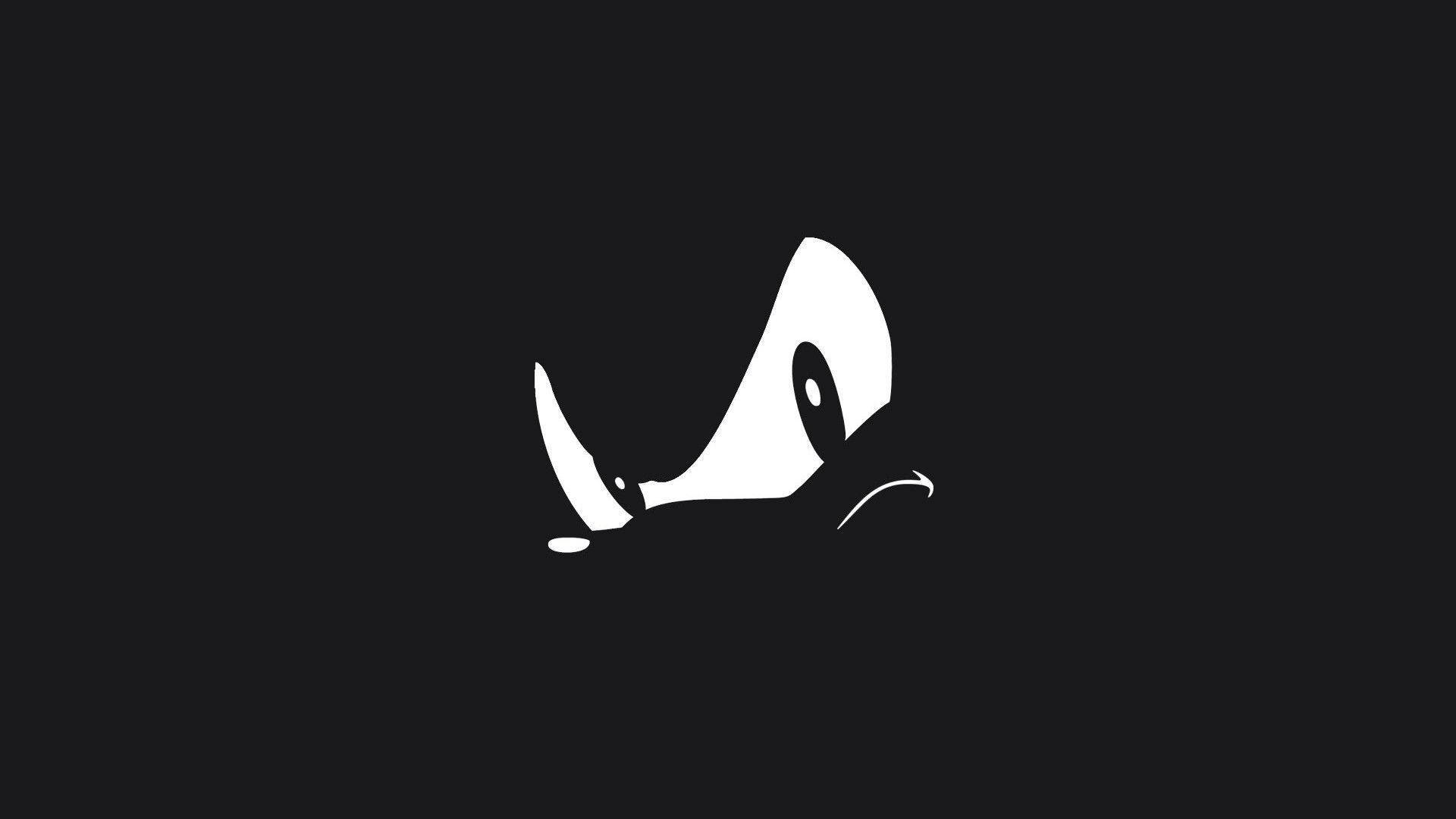 Dark Sonic 桌布 壁紙 — 一個極簡風格的白色犀牛頭剪影，有一個角和一個眼睛，在純黑色背景上。