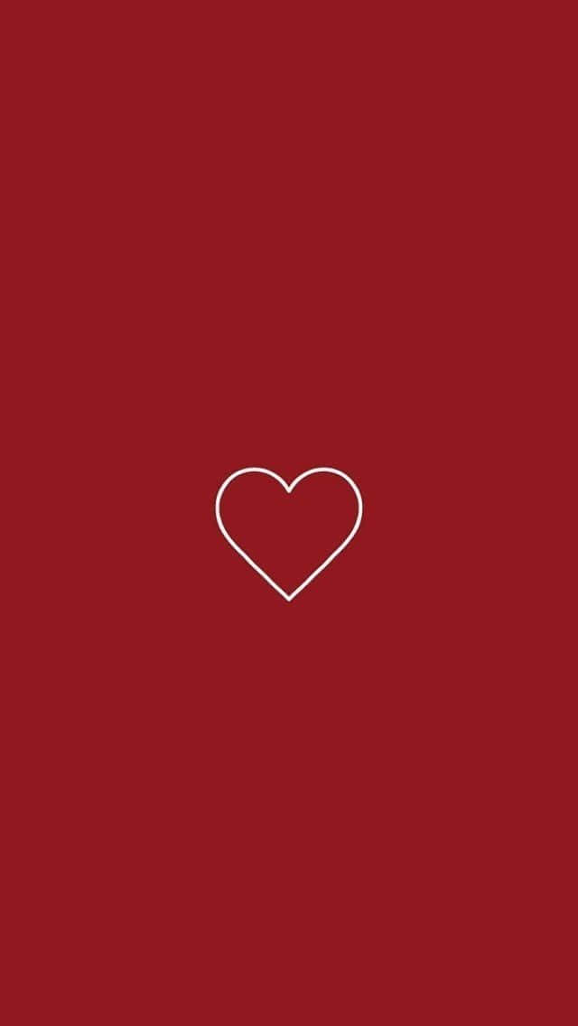 Soft Red Aesthetic 桌布 壁紙 — 一個極簡風格的白色輪廓心形，居中在純深紅色背景上。