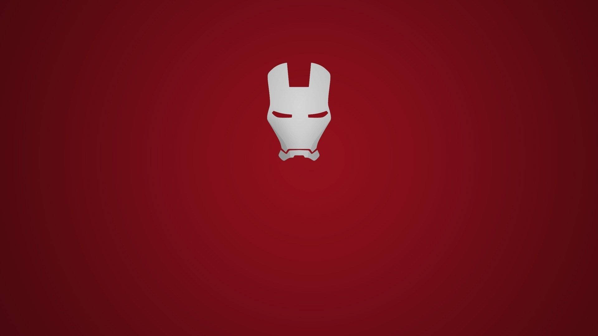 Iron Man Logo 桌布 壁紙 — 一個極簡風格的白色鋼鐵人頭盔圖示，居中放置在漸變紅色背景上。