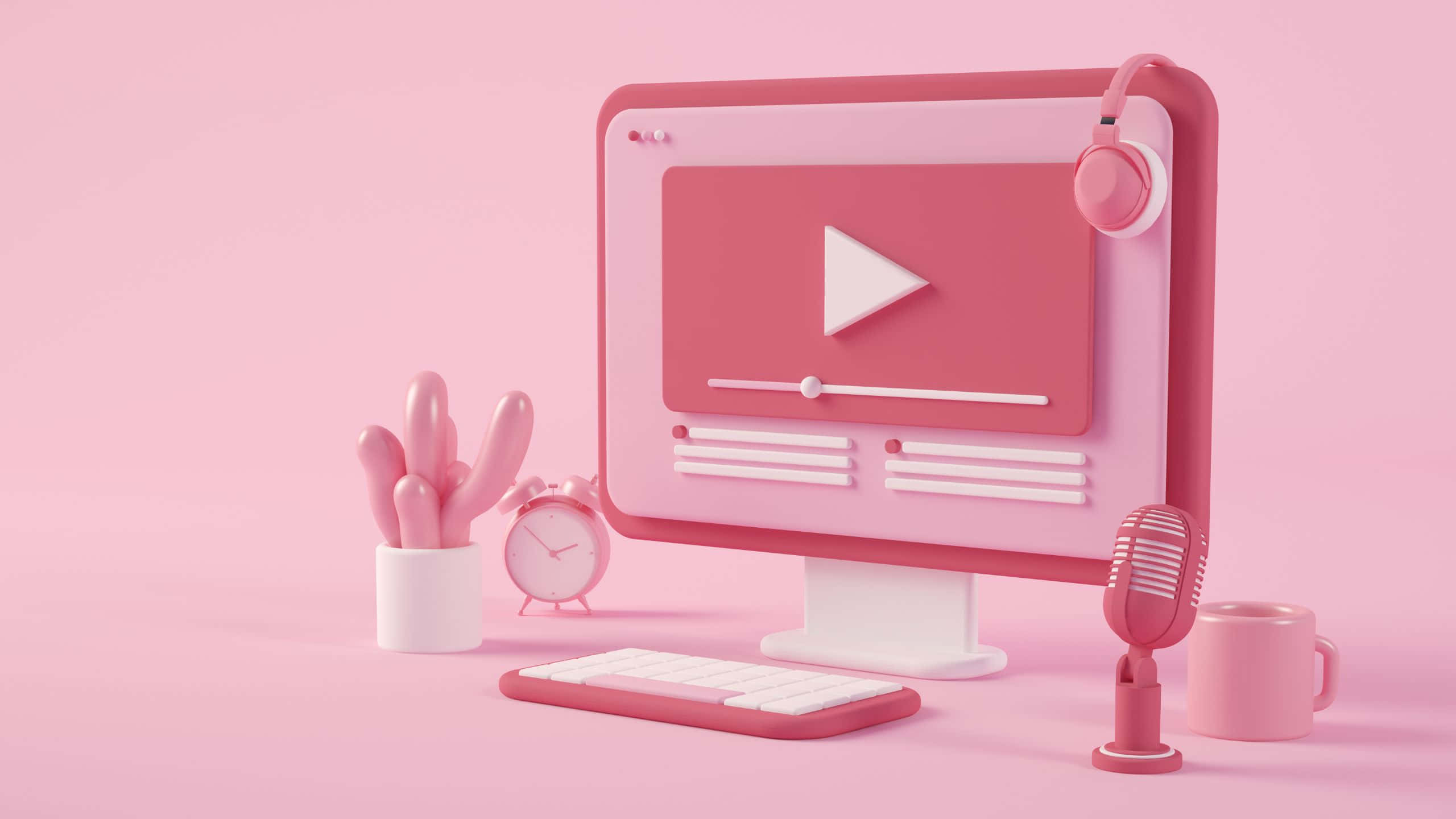 Streaming 桌布 壁紙 — 一個極簡風格的粉紅色3D渲染桌面設置，配備帶有播放按鈕的電腦顯示器、麥克風、鍵盤、鬧鐘和仙人掌。