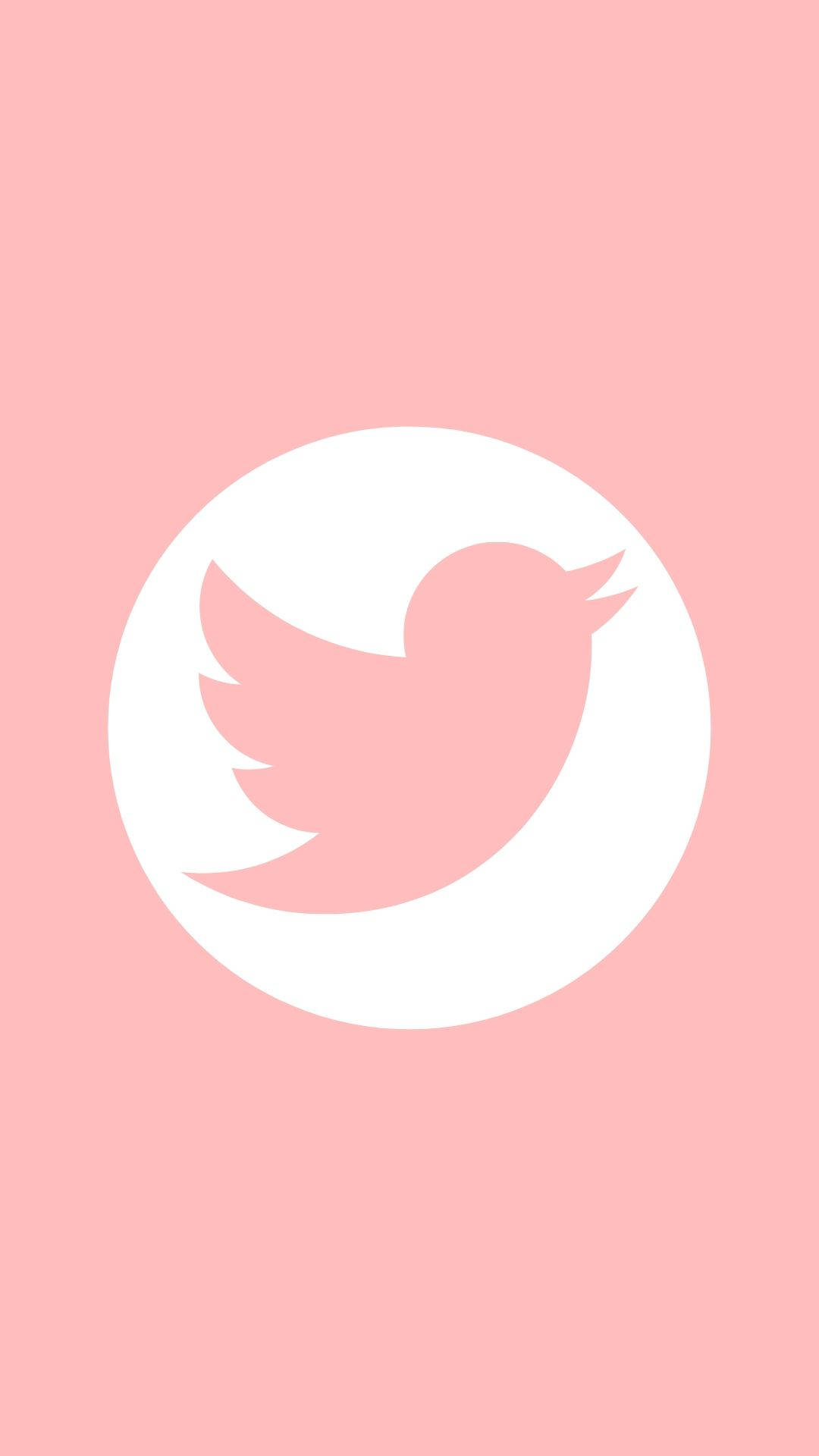 Twitter 桌布 壁紙 — 一個極簡風格的粉紅色Twitter鳥標誌，位於白色圓圈中央，背景為柔和粉紅色。