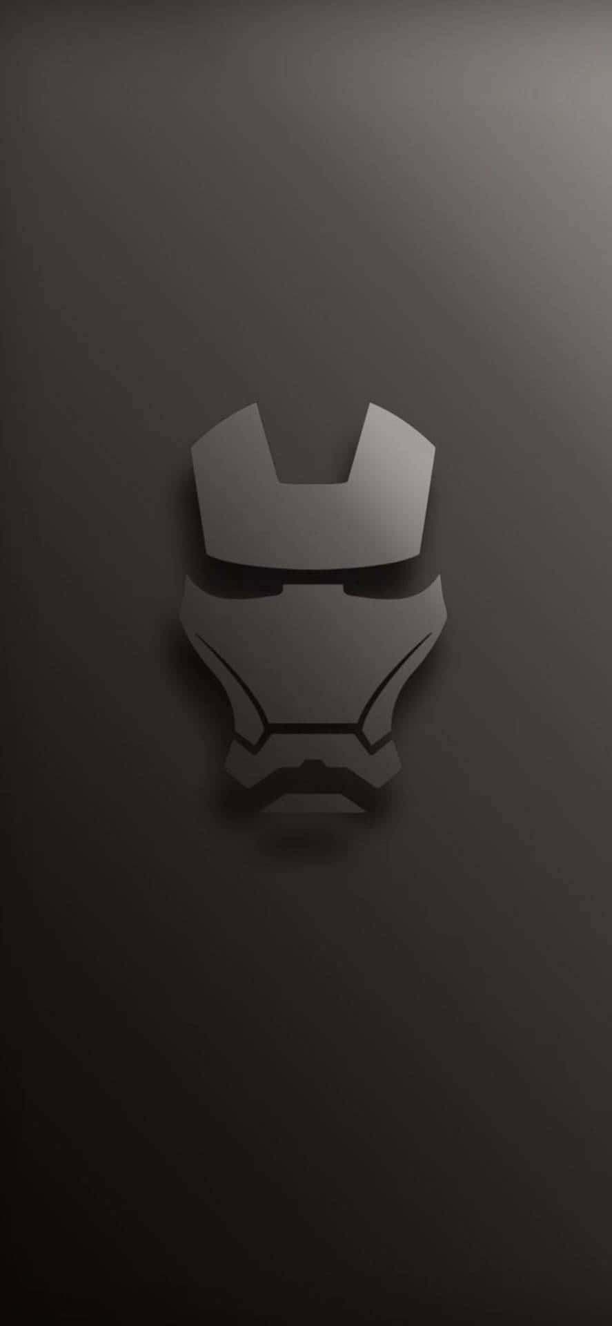 Iron Man Black And White 桌布 壁紙 — 一個極簡風格的金屬鋼鐵人頭盔剪影，居中放置在深灰色漸變背景上。