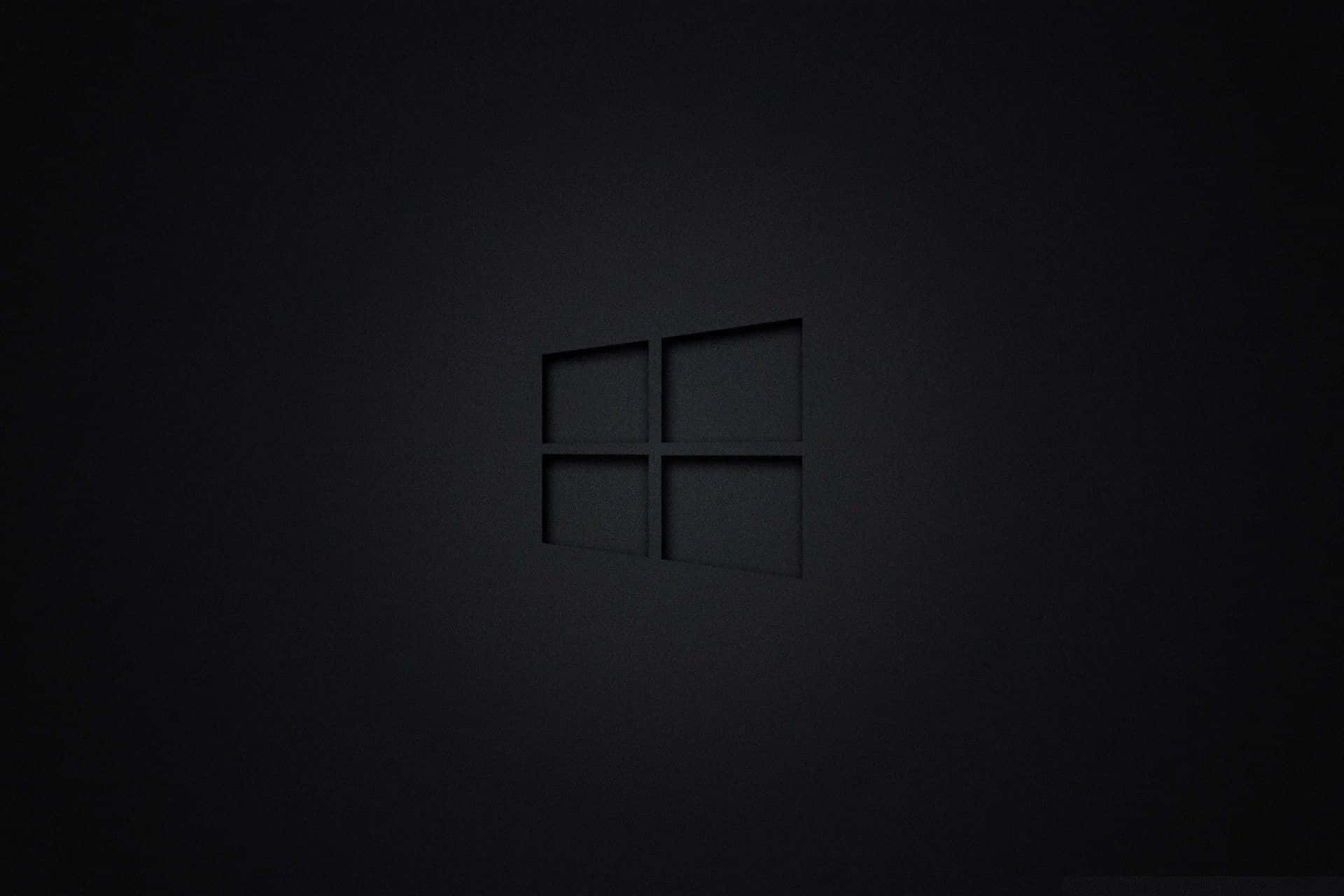 Pitch Black 桌布 壁紙 — 一個極簡風格的黑色Windows標誌，在霧面深色表面上帶有柔和陰影的微妙浮雕效果。