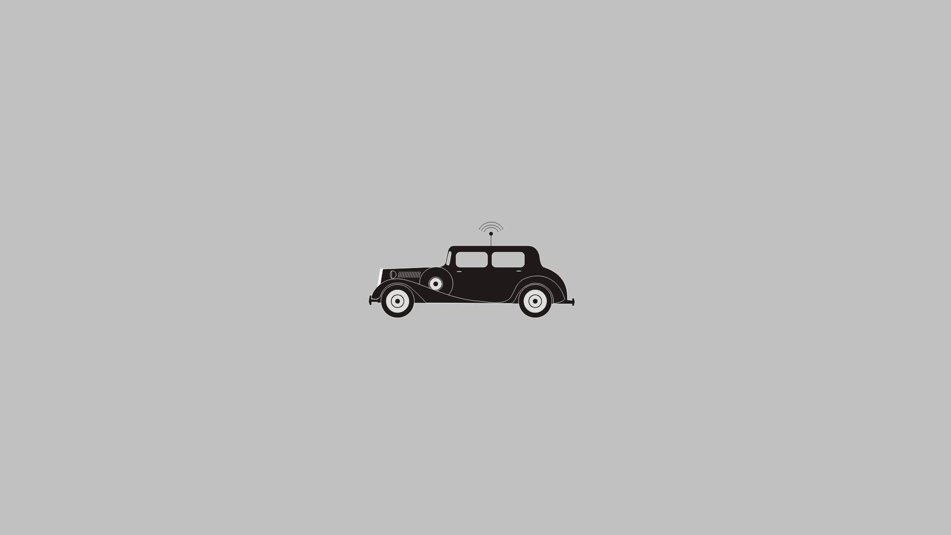 Vintage Minimalist 桌布 壁紙 — 一個極簡風格的黑色剪影，描繪一輛車頂帶有無線信號圖標的復古汽車，背景為純灰色。