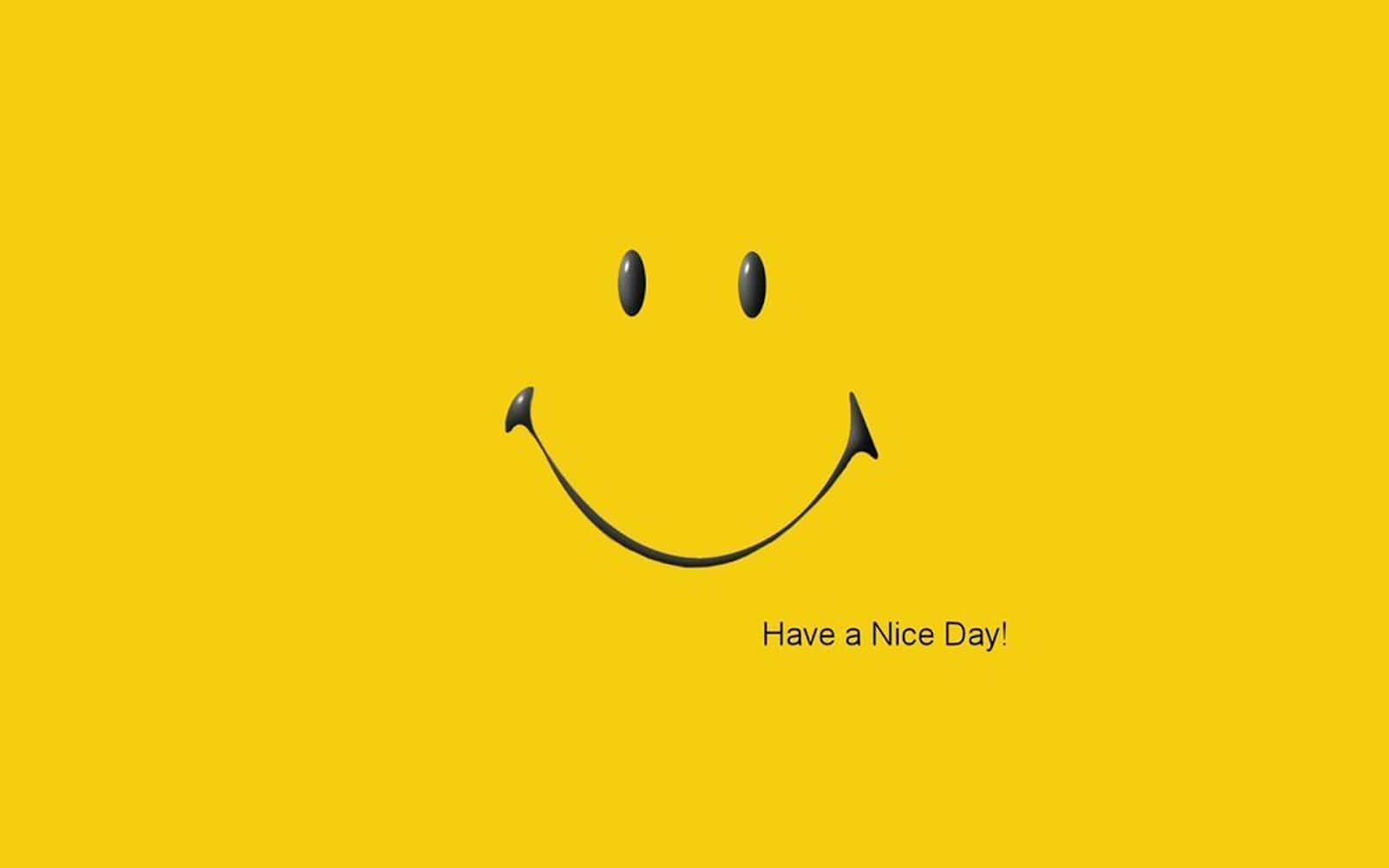  壁紙 — 一個極簡風格的黑色笑臉，中央帶有 Have a Nice Day! 文字，置於純黃色背景上。