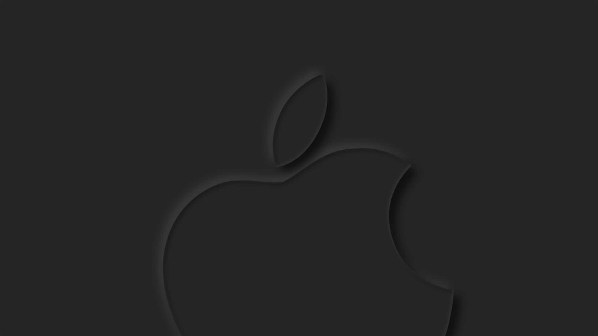 Black Apple Logo 桌布 壁紙 — 一個極簡黑色Apple標誌，在深炭灰色背景上帶有柔和陰影深度，低調壓印。