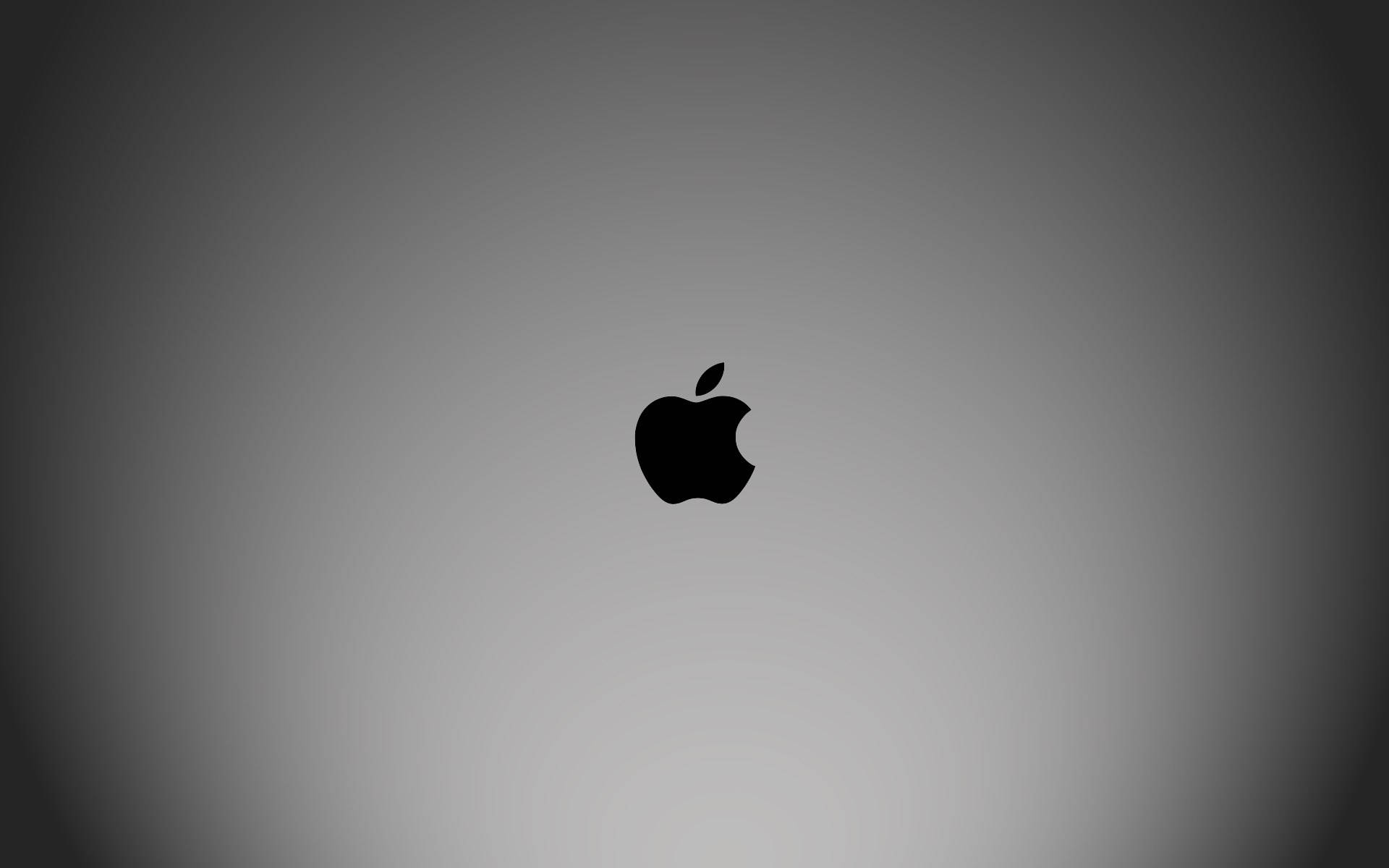 桌布 壁紙 — 一個極簡黑色Apple標誌，居中放置在柔和漸變灰色背景上。